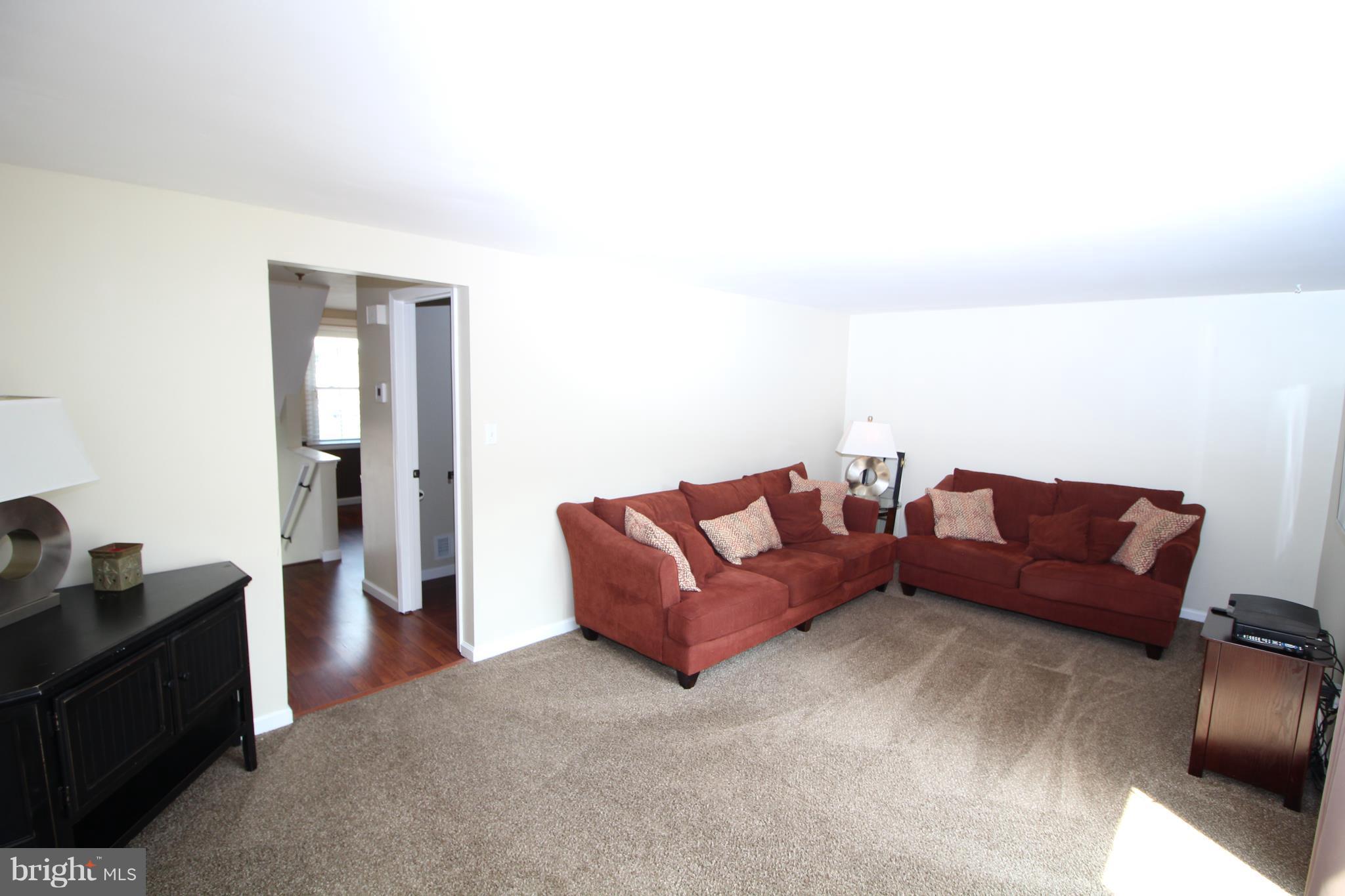 17667 Kohlhoss Road Poolesville, MD 20837 - Photo 6 of 27 a living room with furniture and a couch