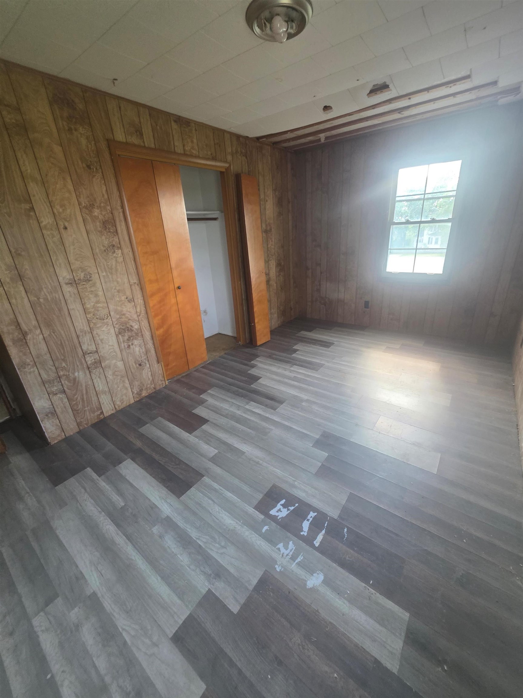 903 Sterling Road Dixon, IL 61021 - Photo 19 of 24 wooden floor in an empty room with a window