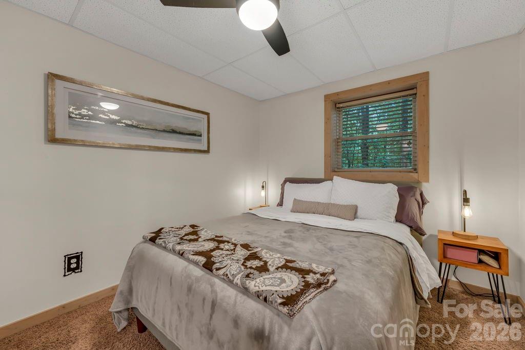 192 Dewitt Barnett Road, Unit 2 Vilas, NC 28692 - Photo 29 of 32 a bed sitting in a bedroom next to a window