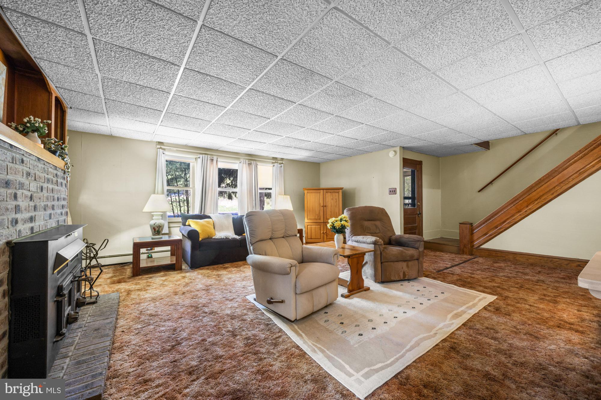 2137 Sicklerville Road Sicklerville, NJ 08081 - Photo 16 of 32 a living room with furniture and a fireplace
