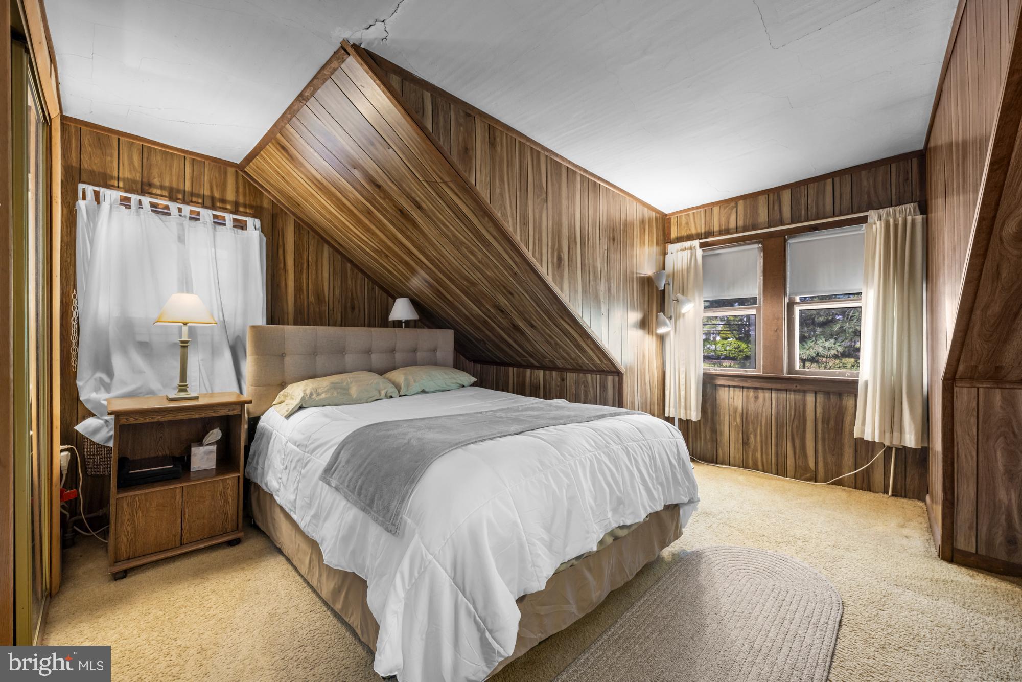 2137 Sicklerville Road Sicklerville, NJ 08081 - Photo 24 of 32 a bedroom with a bed and a chandelier