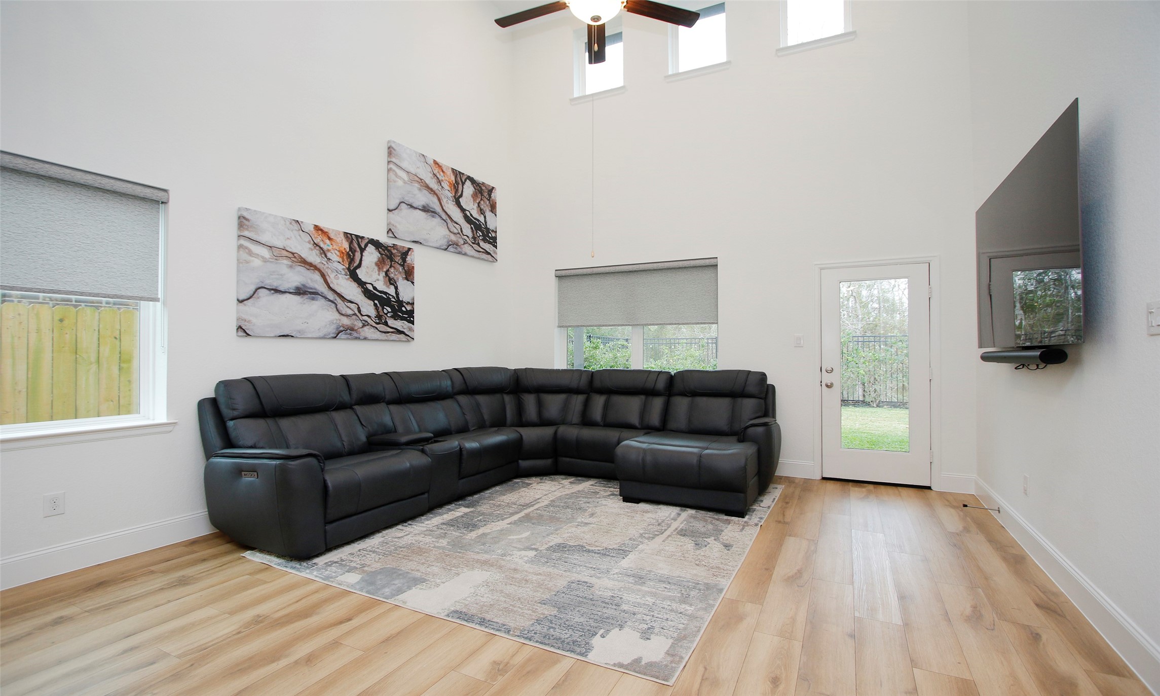 2741 Altissimo Court Spring, TX 77386 - Photo 10 of 30 Another view of the living area giving direct access to the backyard! It’s the perfect setup for easy indoor-outdoor living!