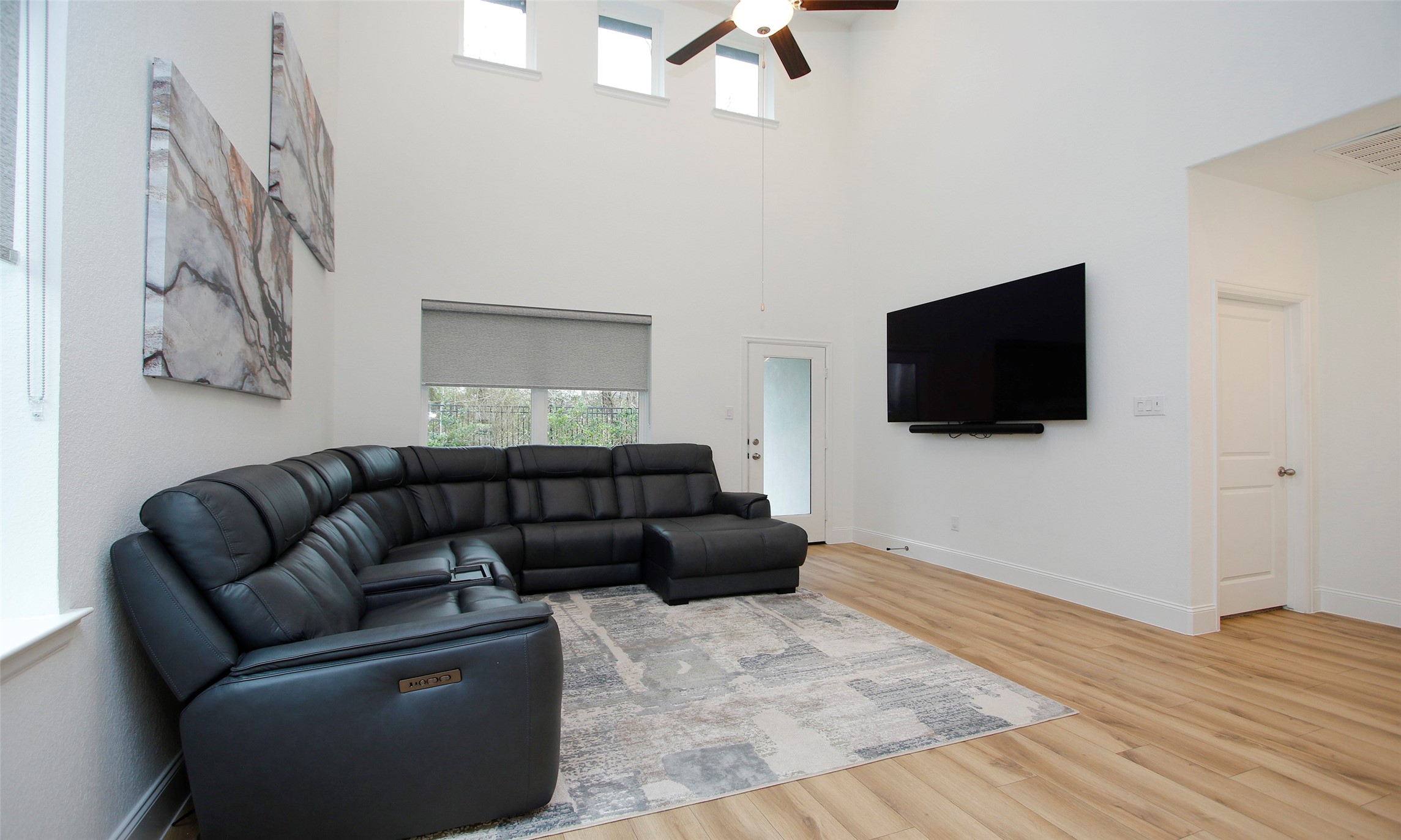 2741 Altissimo Court Spring, TX 77386 - Photo 11 of 30 Expansive living area featuring double-height ceilings and high-set windows for incredible natural light!