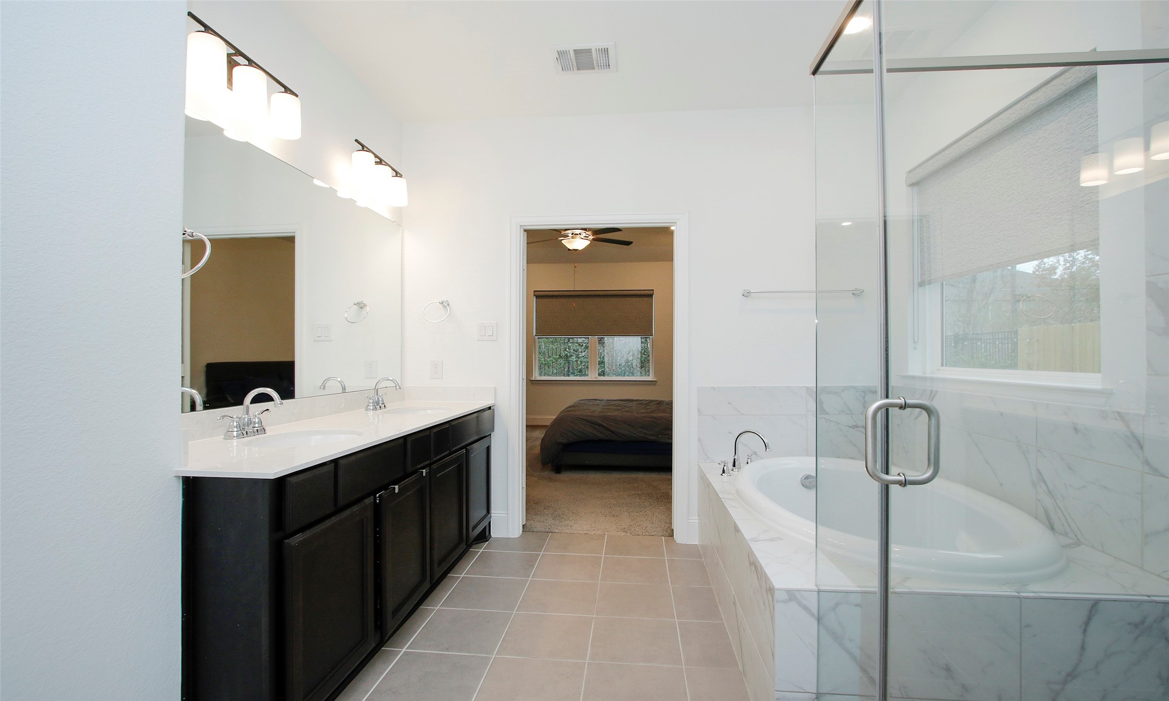 2741 Altissimo Court Spring, TX 77386 - Photo 15 of 30 Notice the spacious double vanity and bright overhead lighting in this primary ensuite, which offers direct access from the bedroom.