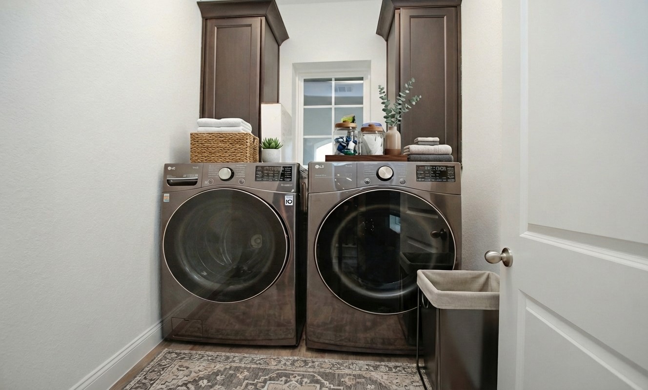 2741 Altissimo Court Spring, TX 77386 - Photo 19 of 30 The laundry room featuring built-in floor-to-ceiling cabinetry for maximum storage!