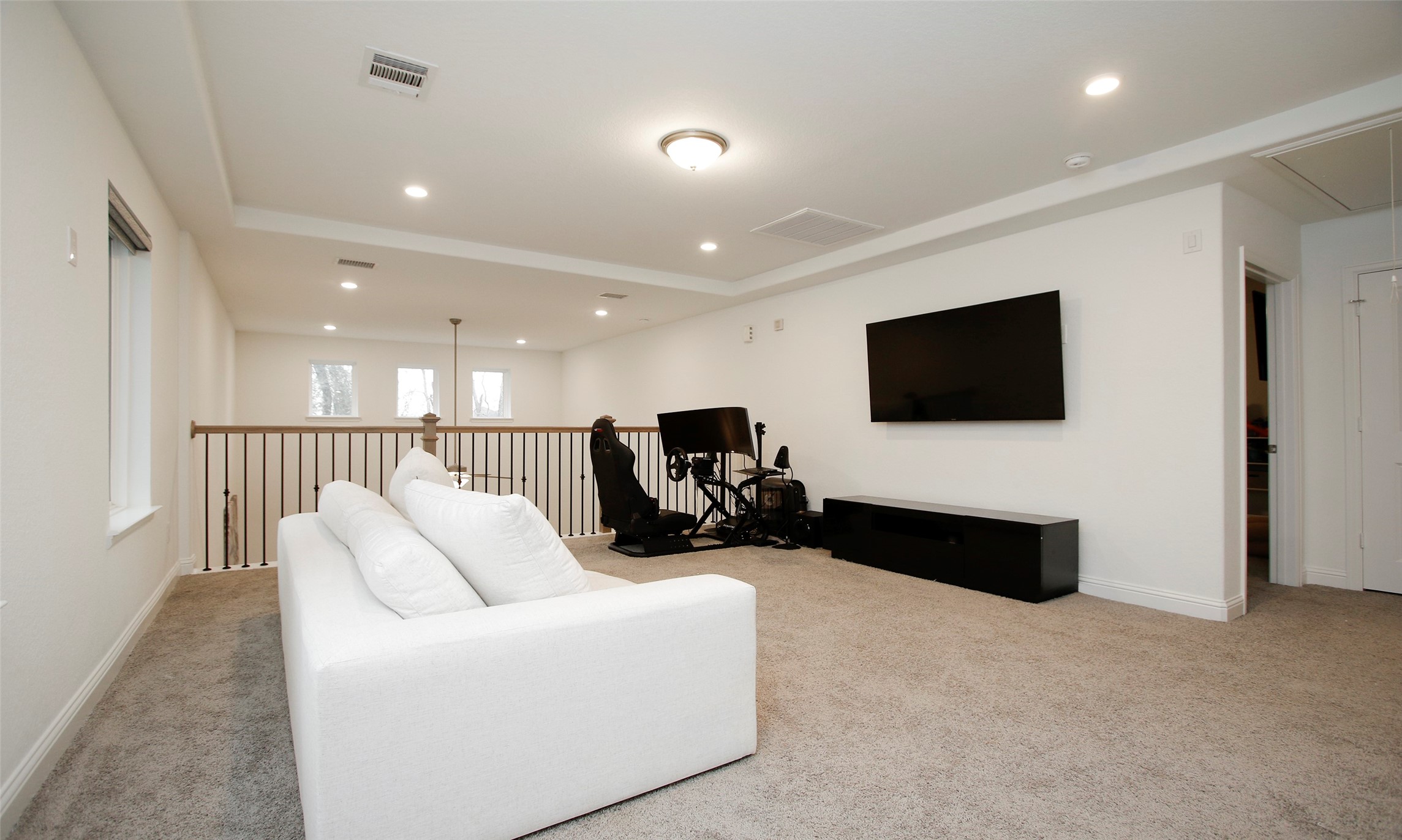 2741 Altissimo Court Spring, TX 77386 - Photo 20 of 30 Expansive game room upstairs showing off the tray ceiling and ample floor space! This area is ideal for a secondary living space or a dedicated gaming station!