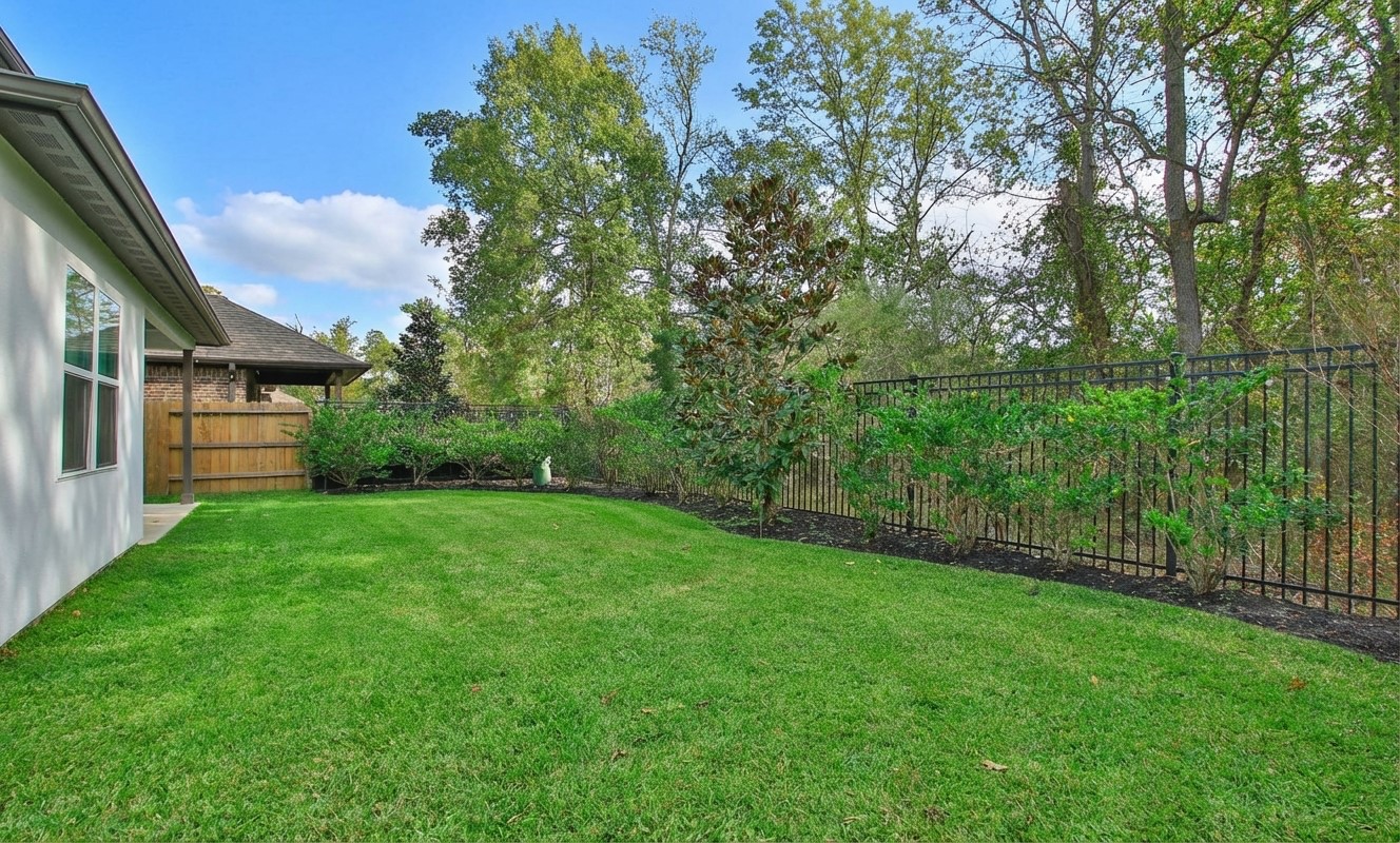 2741 Altissimo Court Spring, TX 77386 - Photo 26 of 30 Wide side yard with a privacy fence and easy access to the back! This long stretch of green space offers plenty of room for a playground or for pets to run around!