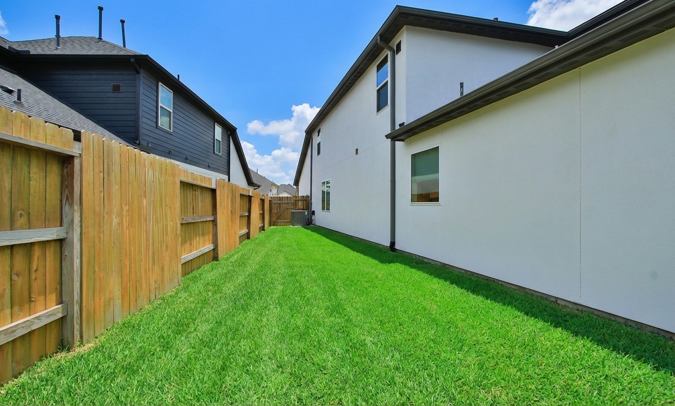2741 Altissimo Court Spring, TX 77386 - Photo 28 of 30 View from the patio looking toward the rear property line! This fully fenced space features a wood fencing for a secure and open feel!