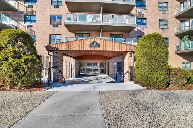 a view of a building with sitting area