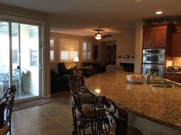 a dining table with chairs and window