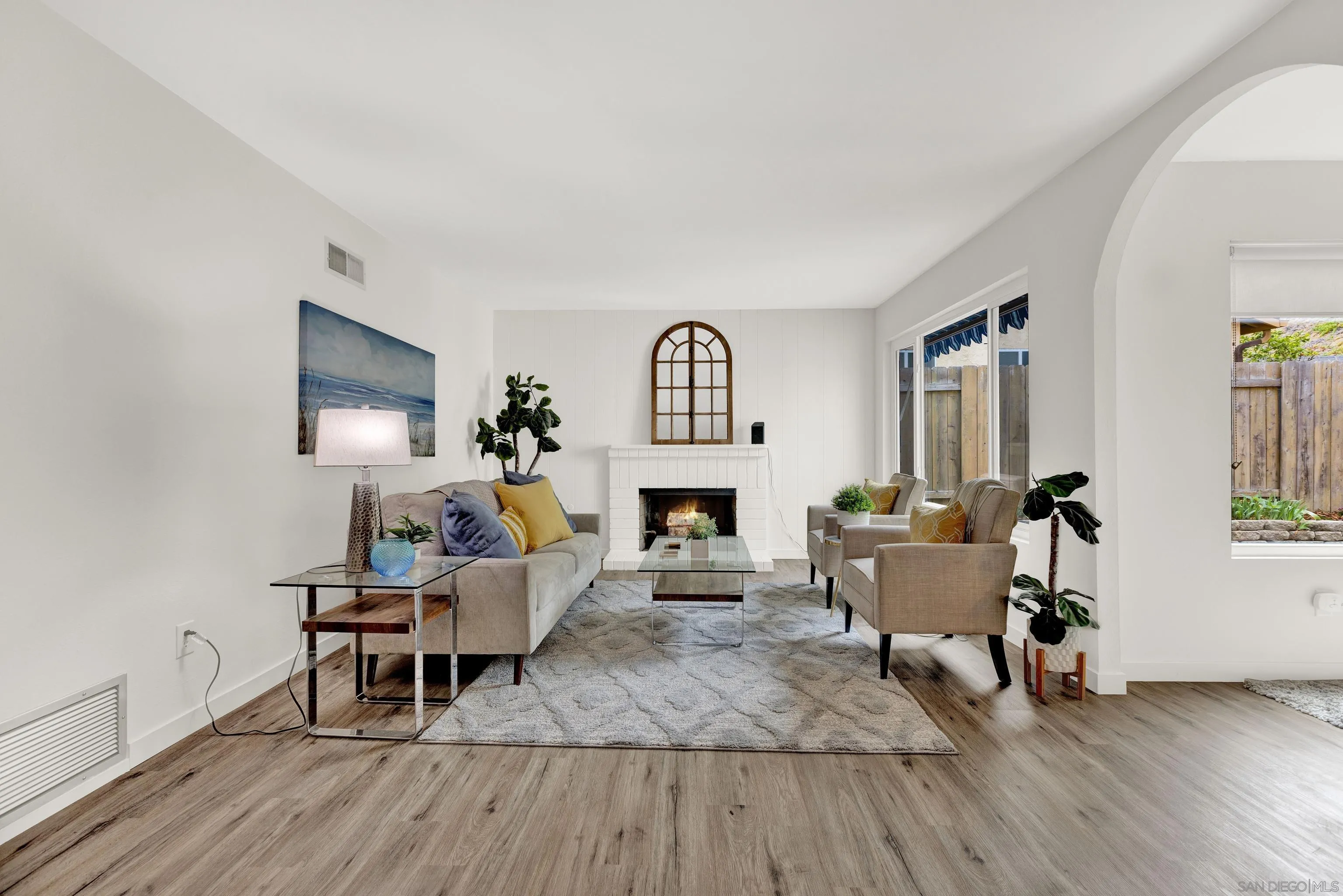 14056 Mazatlan Way Poway, CA 92064 - Photo 3 of 23 a living room with furniture a fireplace and a window