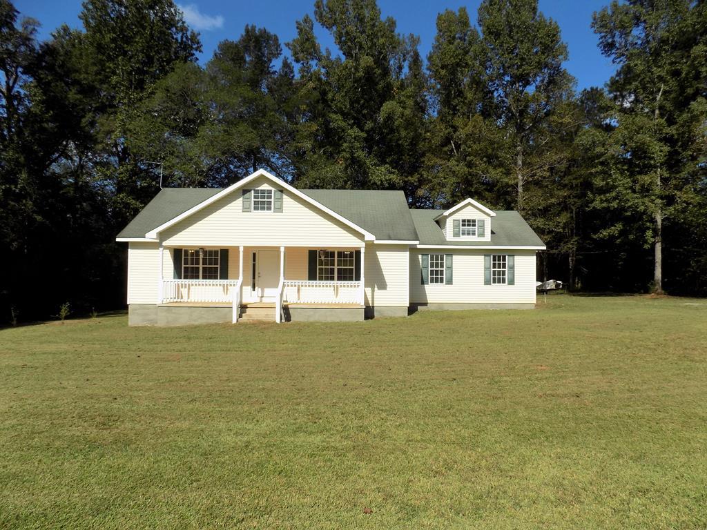 166 Patton Road Gray, GA 31032 - Photo 1 of 22 a front view of a house with a garden