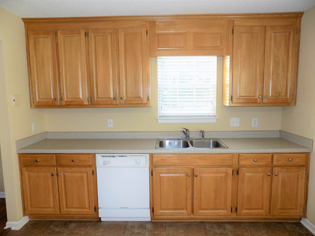 166 Patton Road Gray, GA 31032 - Photo 11 of 22 a kitchen with granite countertop cabinets and window