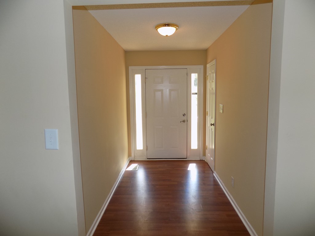 166 Patton Road Gray, GA 31032 - Photo 13 of 22 a view of a hallway with wooden floor