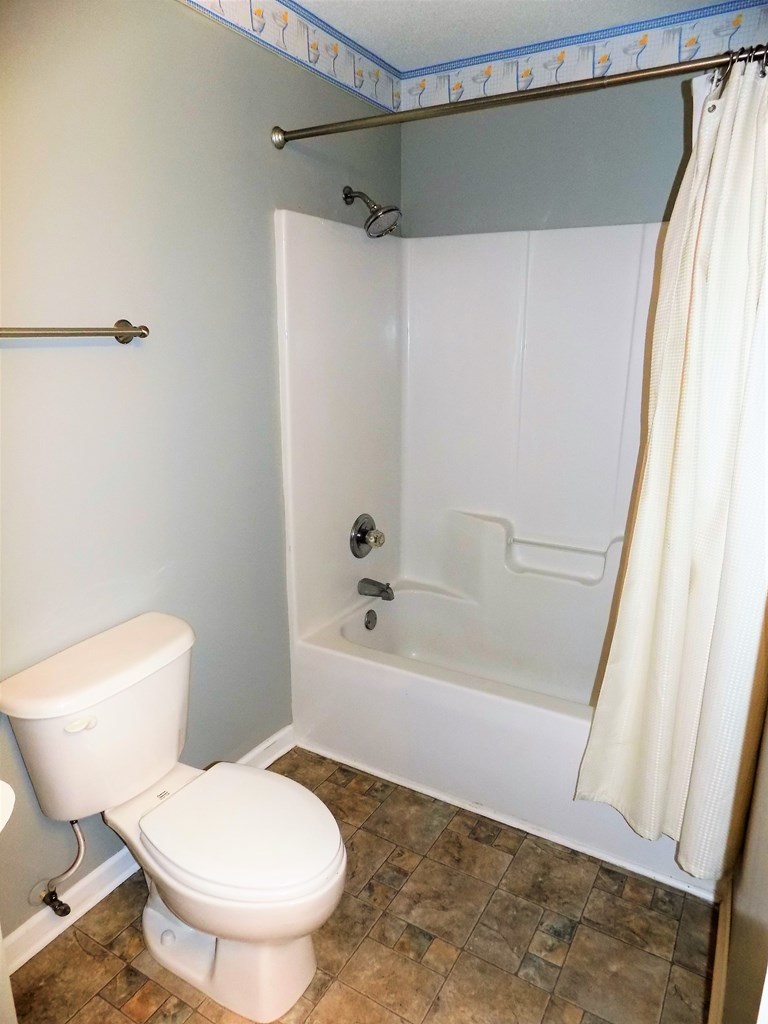 166 Patton Road Gray, GA 31032 - Photo 21 of 22 a white toilet sitting next to a bath tub