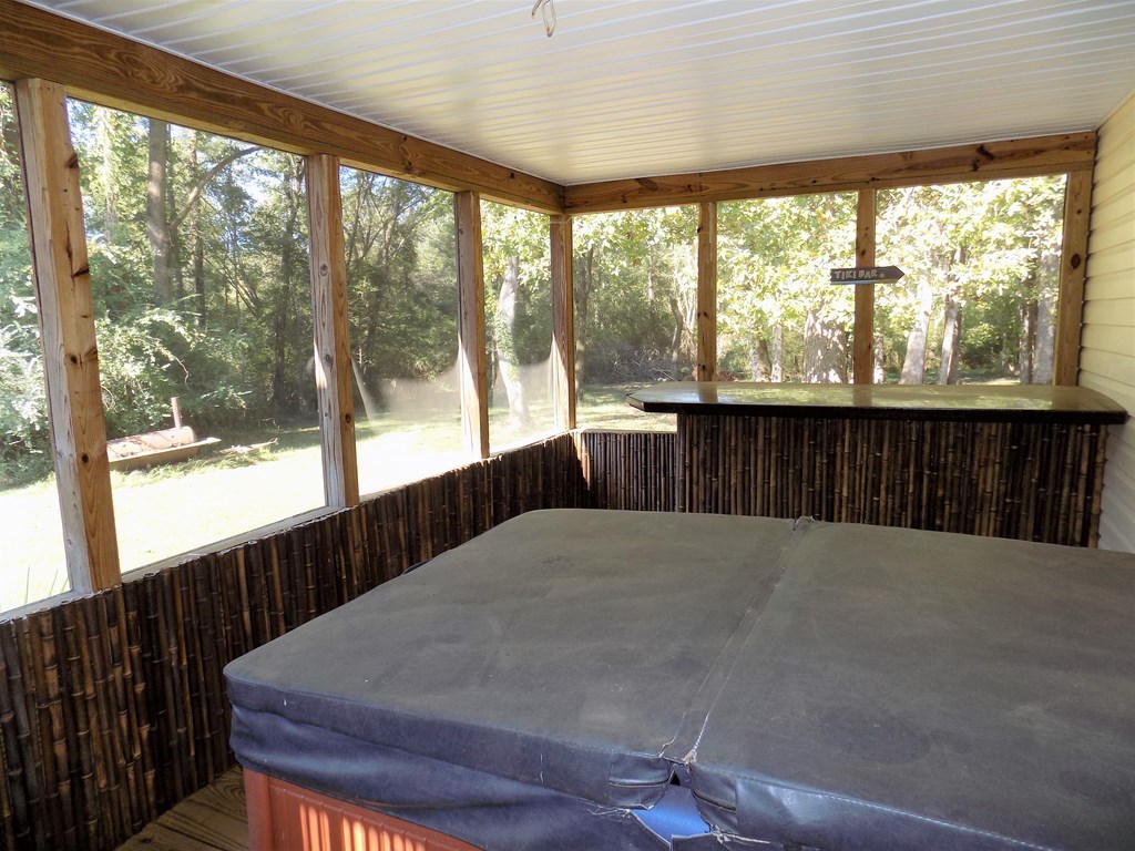 166 Patton Road Gray, GA 31032 - Photo 5 of 22 a bed sitting in a balcony next to a window
