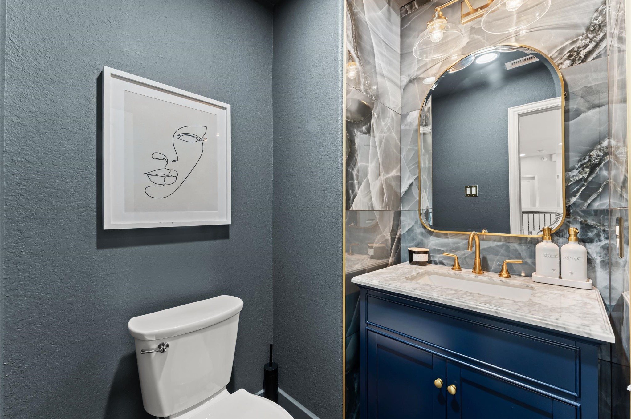 14016 Savannah Landing Lane Rosharon, TX 77583 - Photo 30 of 49 a bathroom with a toilet sink and mirror