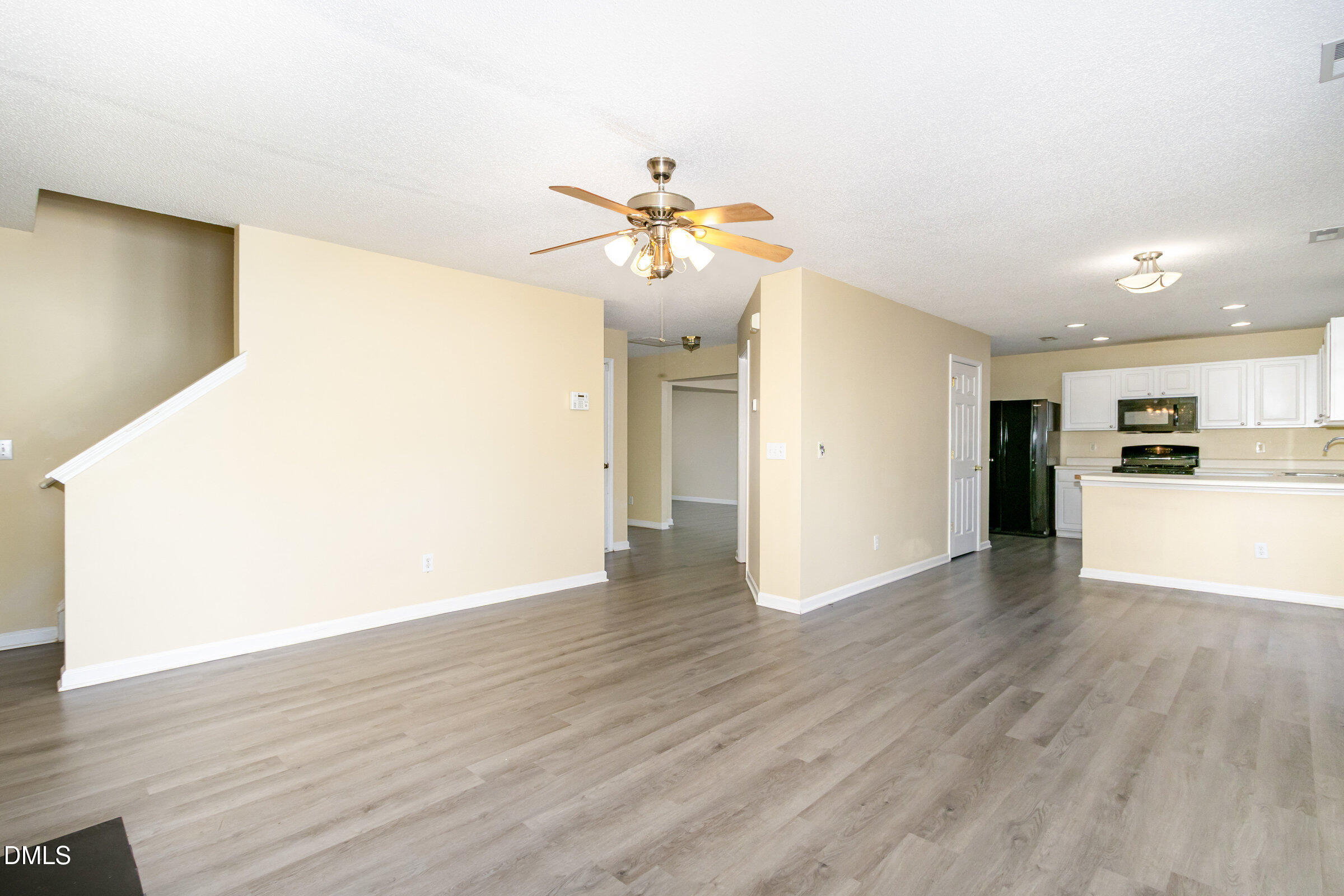 4809 Kaycee Court Raleigh, NC 27616 - Photo 10 of 41 a view of a kitchen with wooden floor and a kitchen space