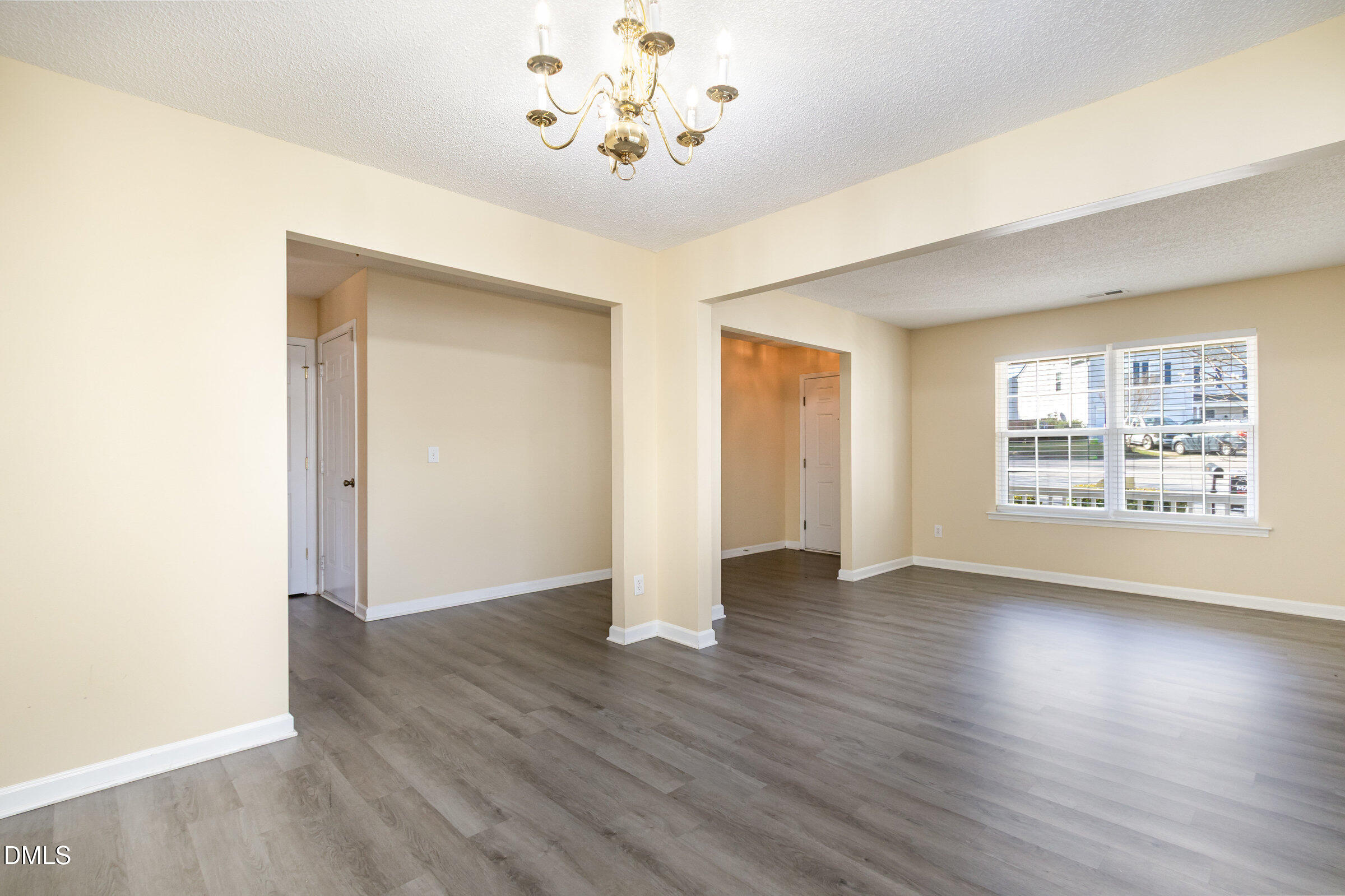 4809 Kaycee Court Raleigh, NC 27616 - Photo 17 of 41 an empty room with wooden floor and windows