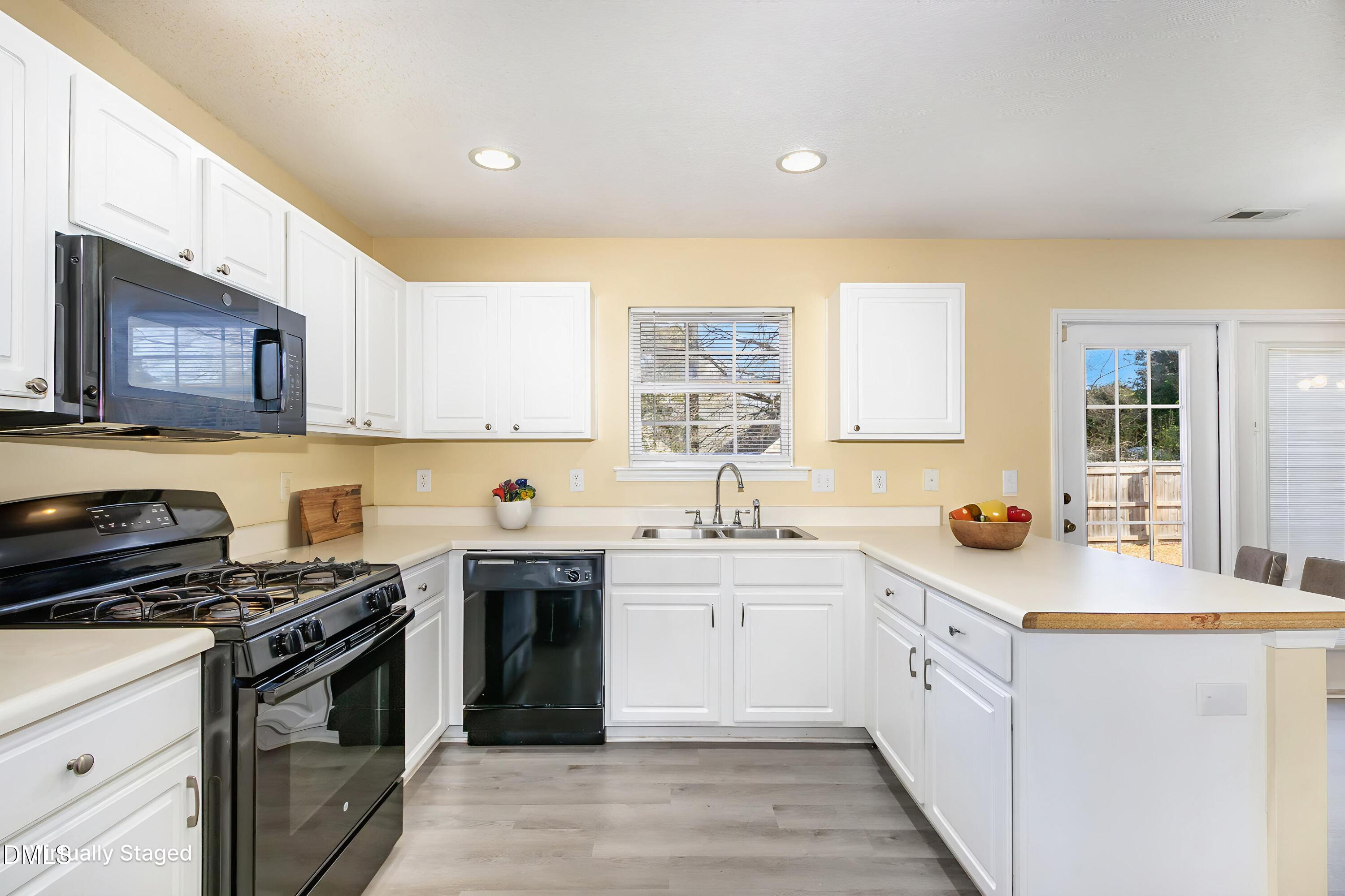 4809 Kaycee Court Raleigh, NC 27616 - Photo 19 of 41 a kitchen that has a sink and a stove in it