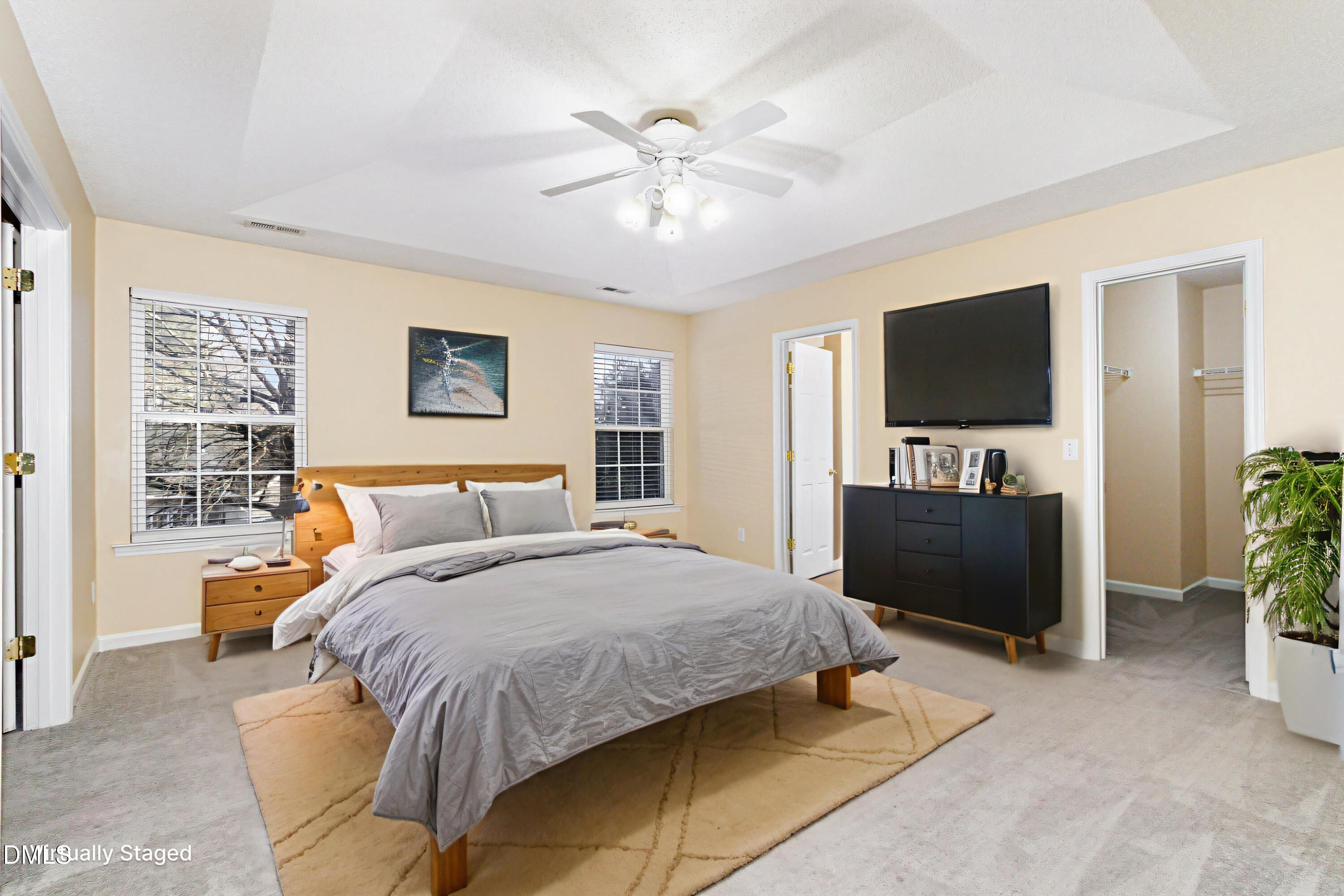 4809 Kaycee Court Raleigh, NC 27616 - Photo 24 of 41 a bedroom with a bed and a flat screen tv