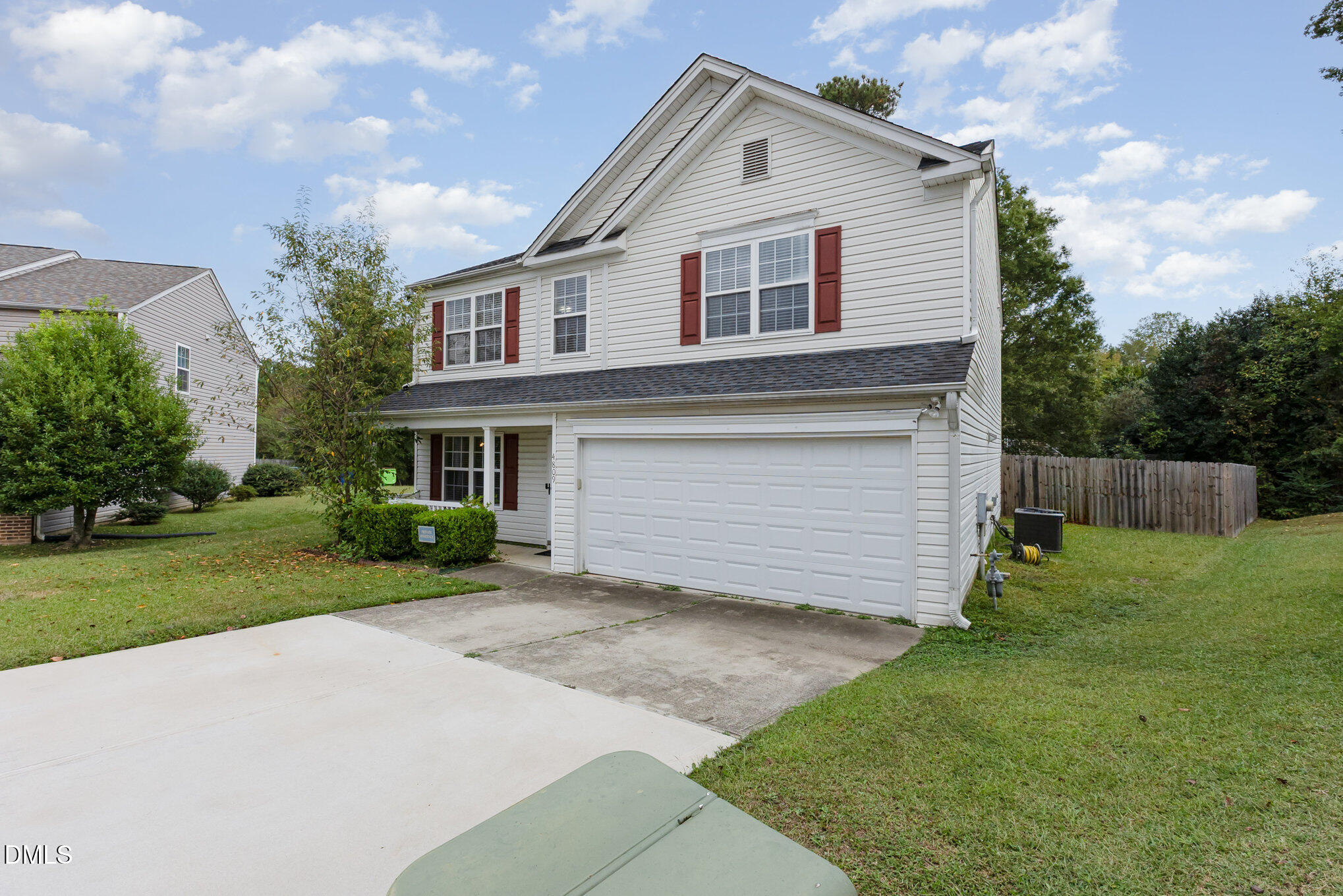 4809 Kaycee Court Raleigh, NC 27616 - Photo 2 of 41 a front view of a house with a yard and garage
