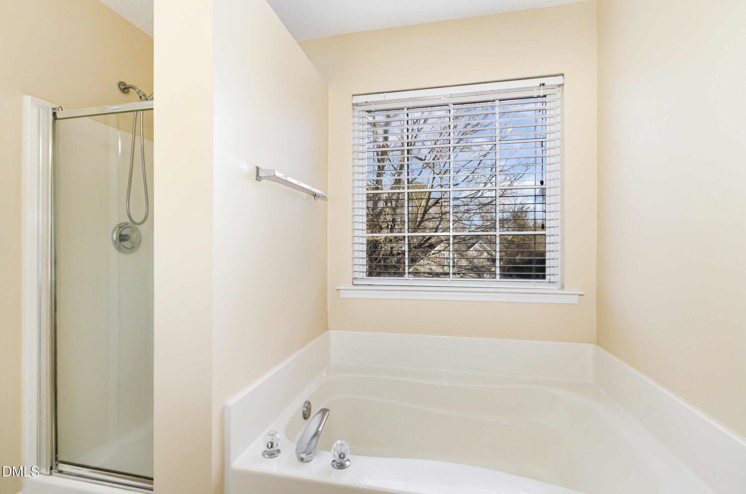 4809 Kaycee Court Raleigh, NC 27616 - Photo 35 of 41 a white bath tub sitting next to a window