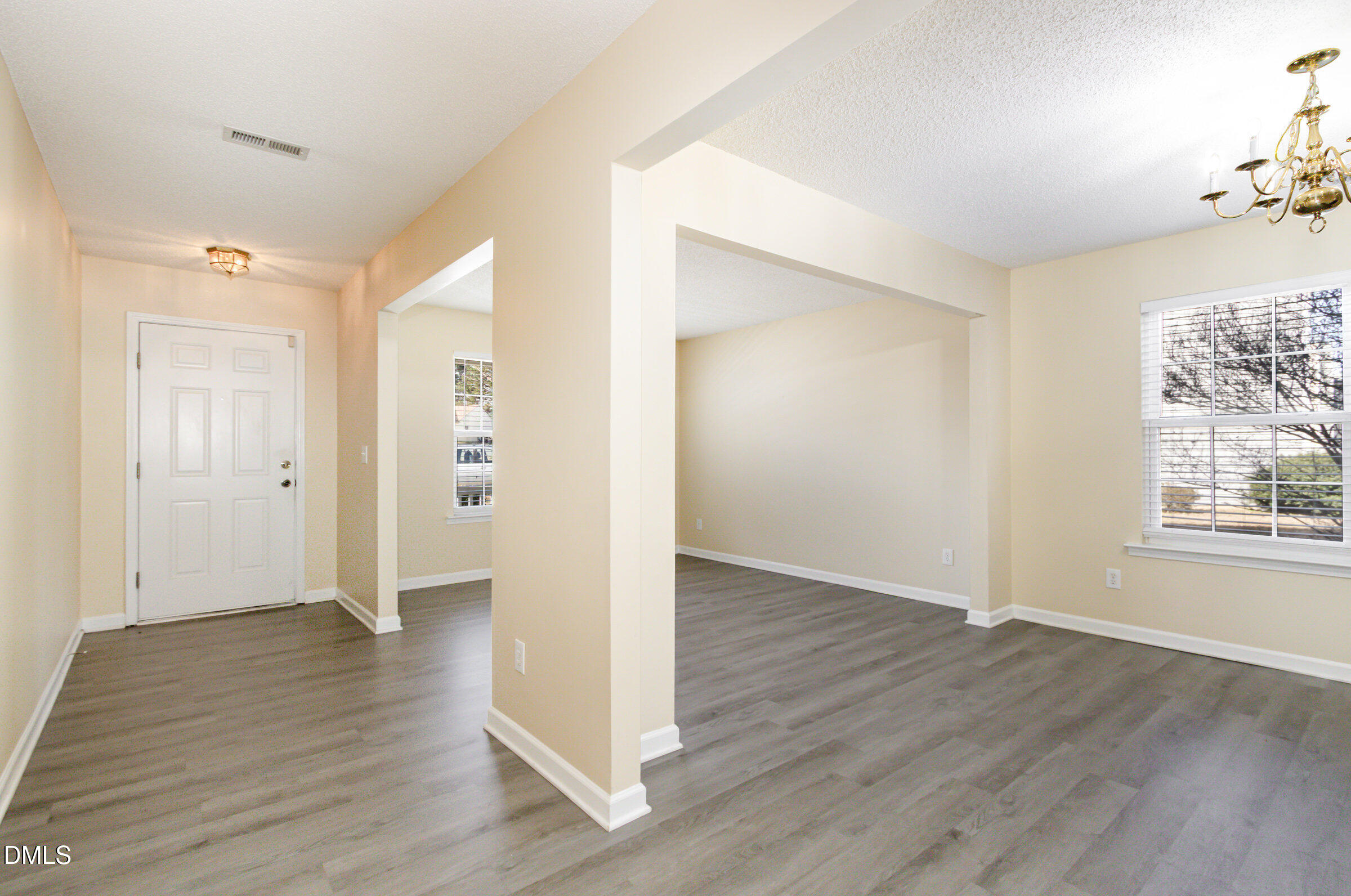 4809 Kaycee Court Raleigh, NC 27616 - Photo 5 of 41 an empty room with wooden floor and windows