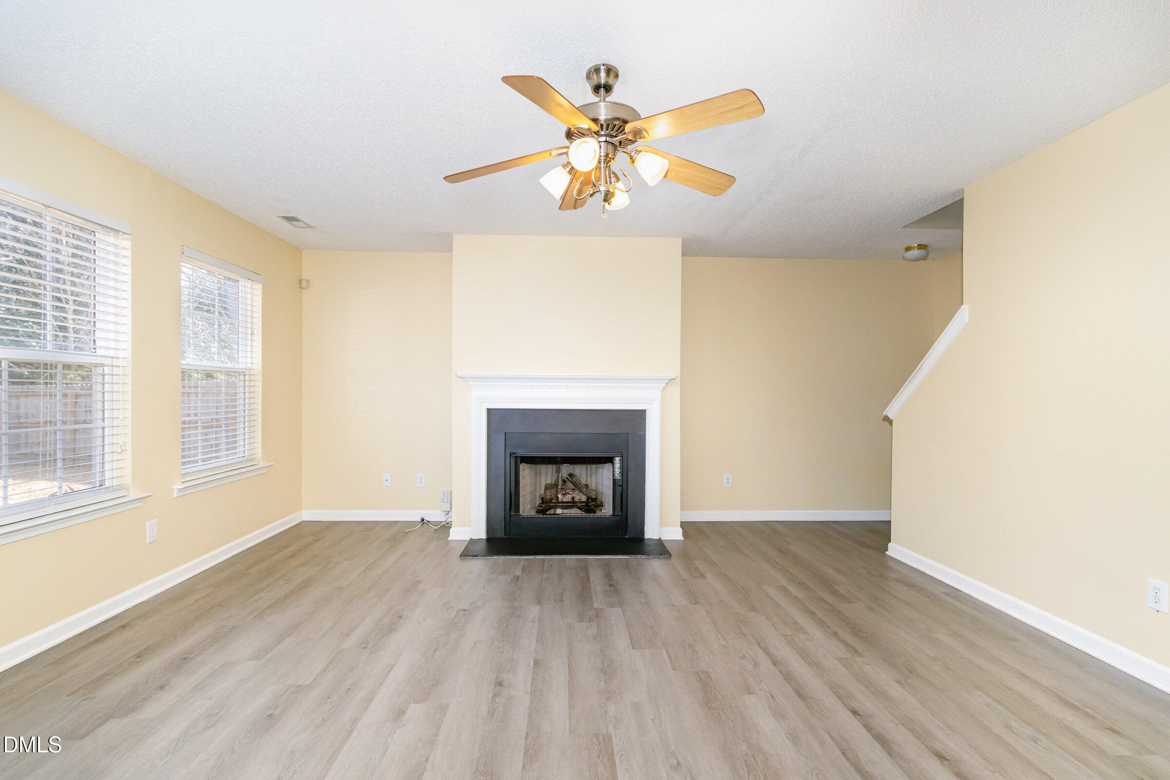 4809 Kaycee Court Raleigh, NC 27616 - Photo 6 of 41 a view of an empty room with a window and a fireplace