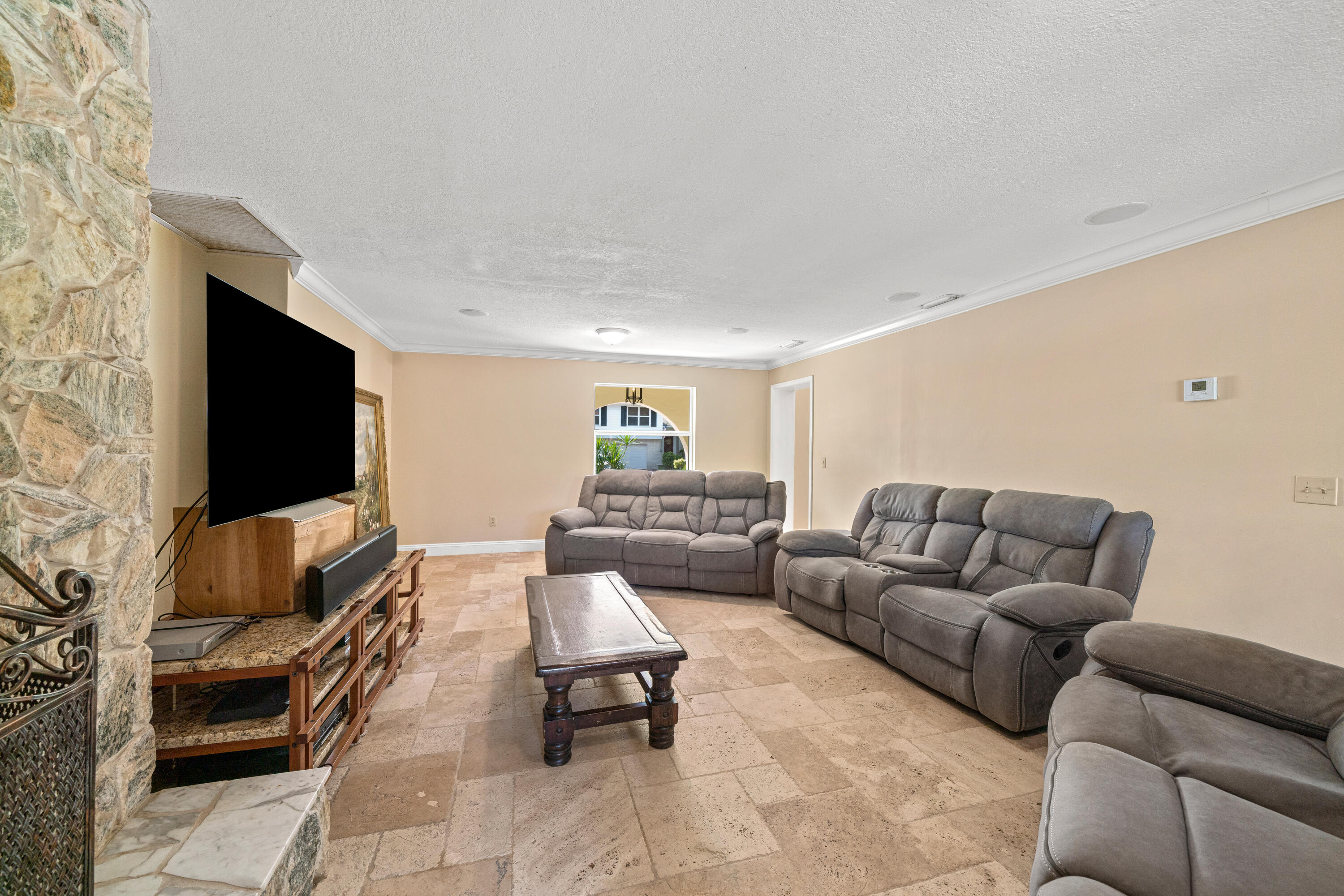 18 Duke Drive Lake Worth, FL 33460 - Photo 11 of 29 a living room with furniture and a flat screen tv