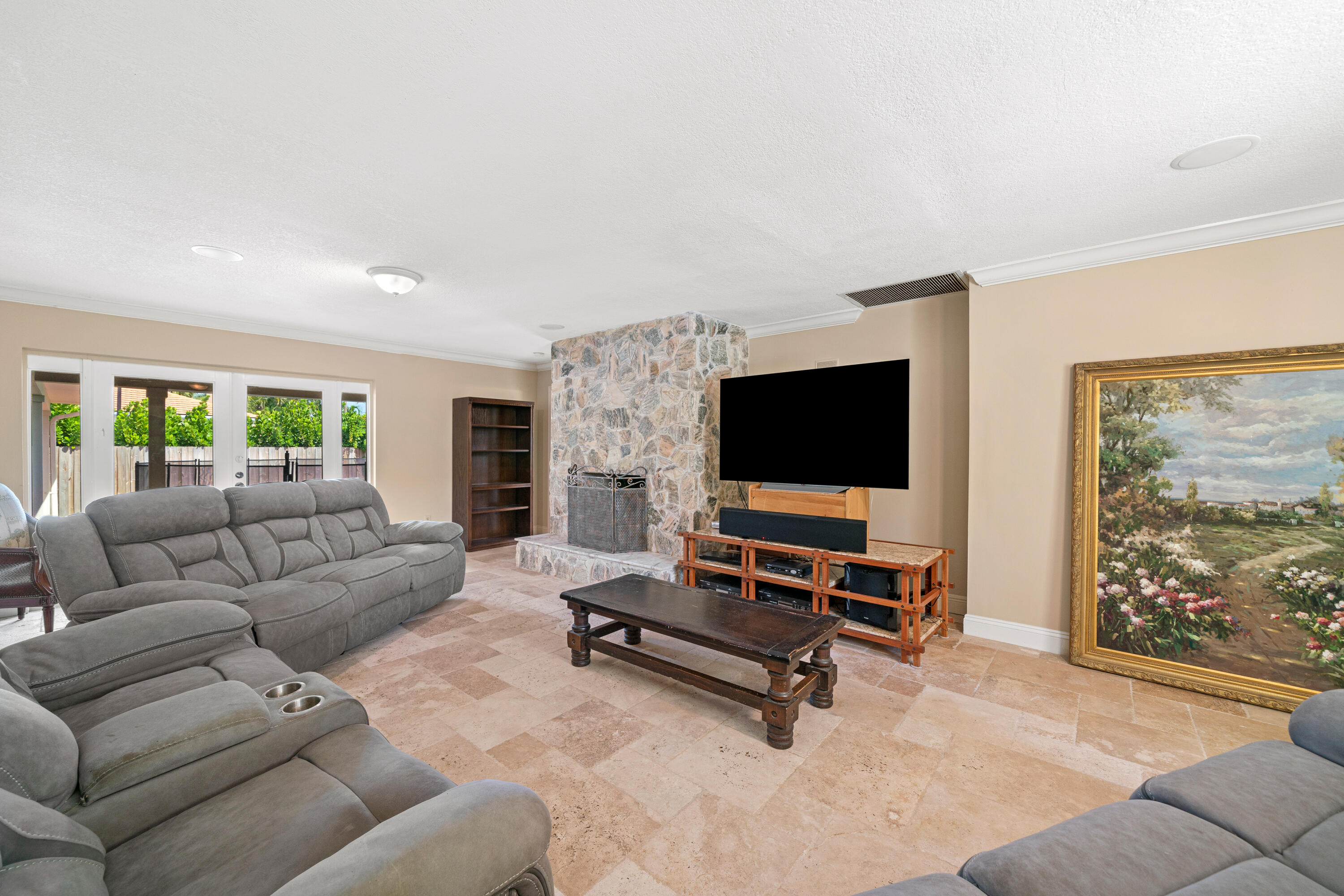 18 Duke Drive Lake Worth, FL 33460 - Photo 12 of 29 a living room with furniture and a flat screen tv