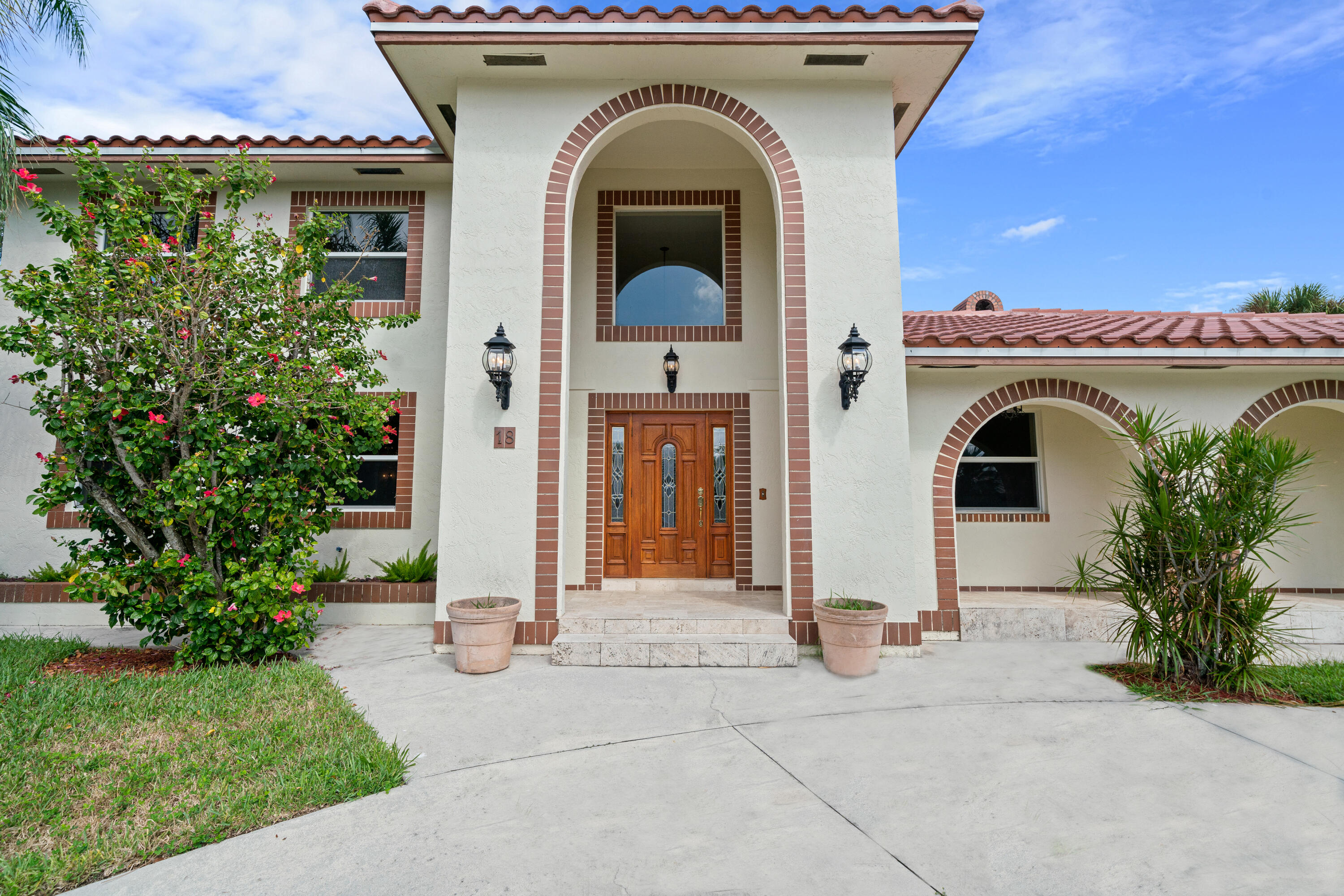 18 Duke Drive Lake Worth, FL 33460 - Photo 3 of 29 a front view of a house with plants