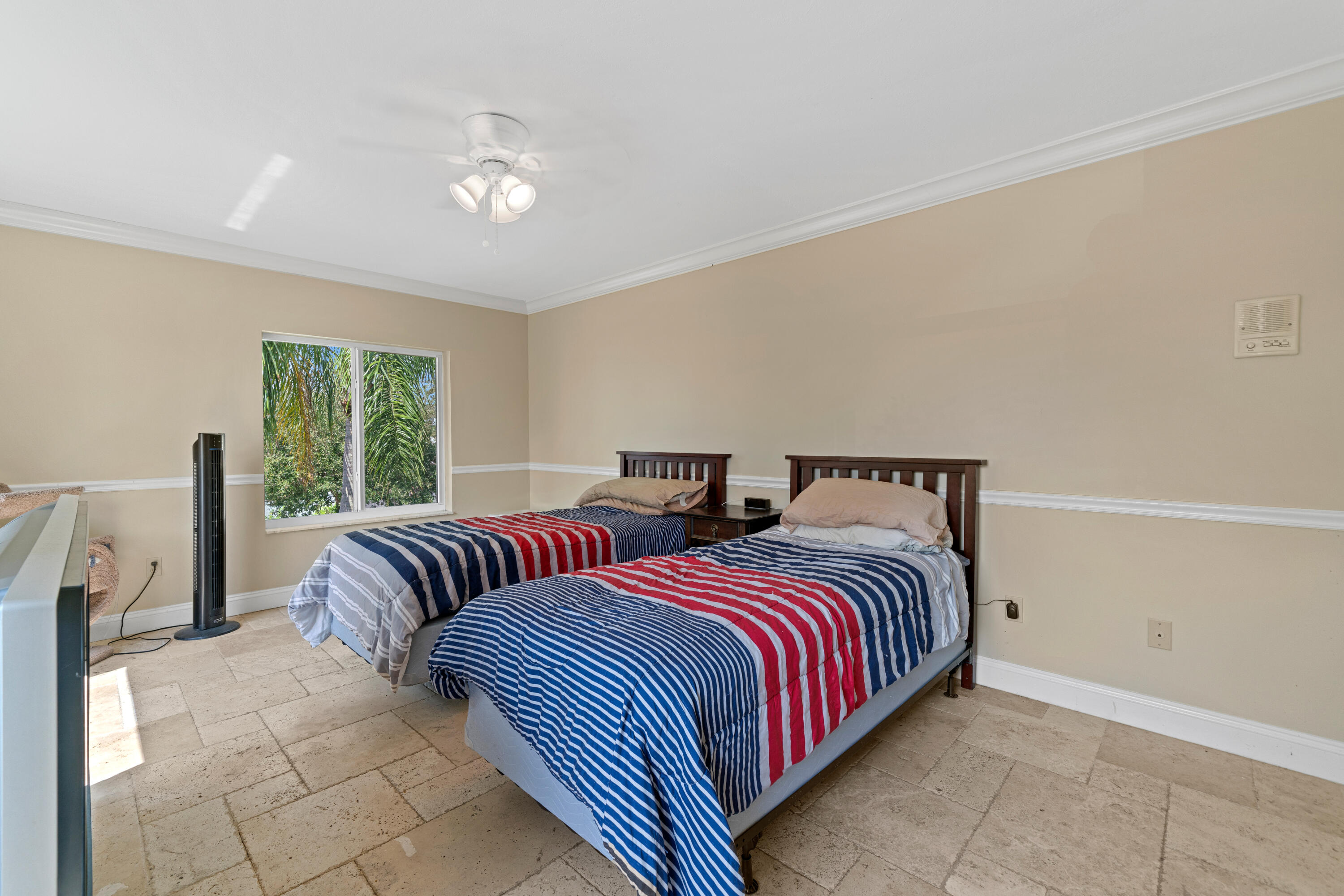 18 Duke Drive Lake Worth, FL 33460 - Photo 23 of 29 a bedroom with two beds and a large window