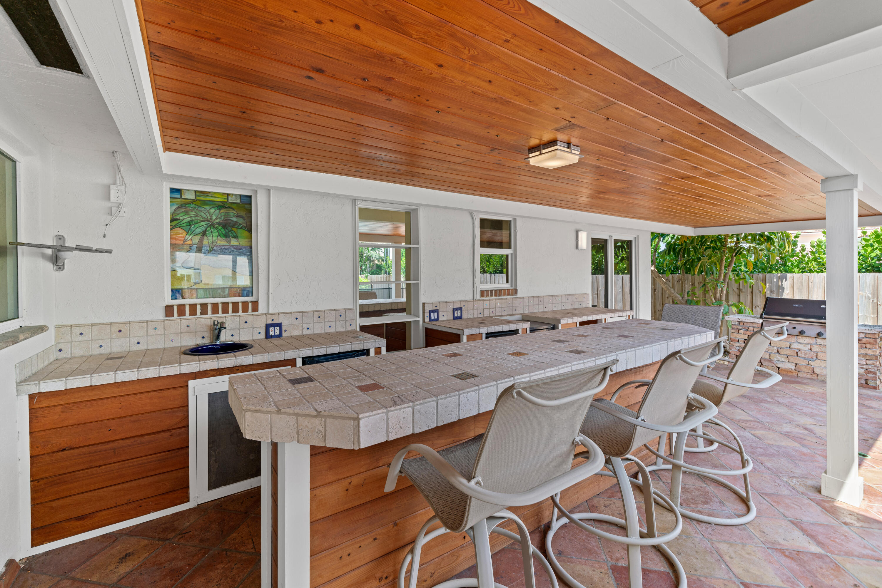 18 Duke Drive Lake Worth, FL 33460 - Photo 26 of 29 a dining hall with stainless steel appliances granite countertop a sink and cabinets