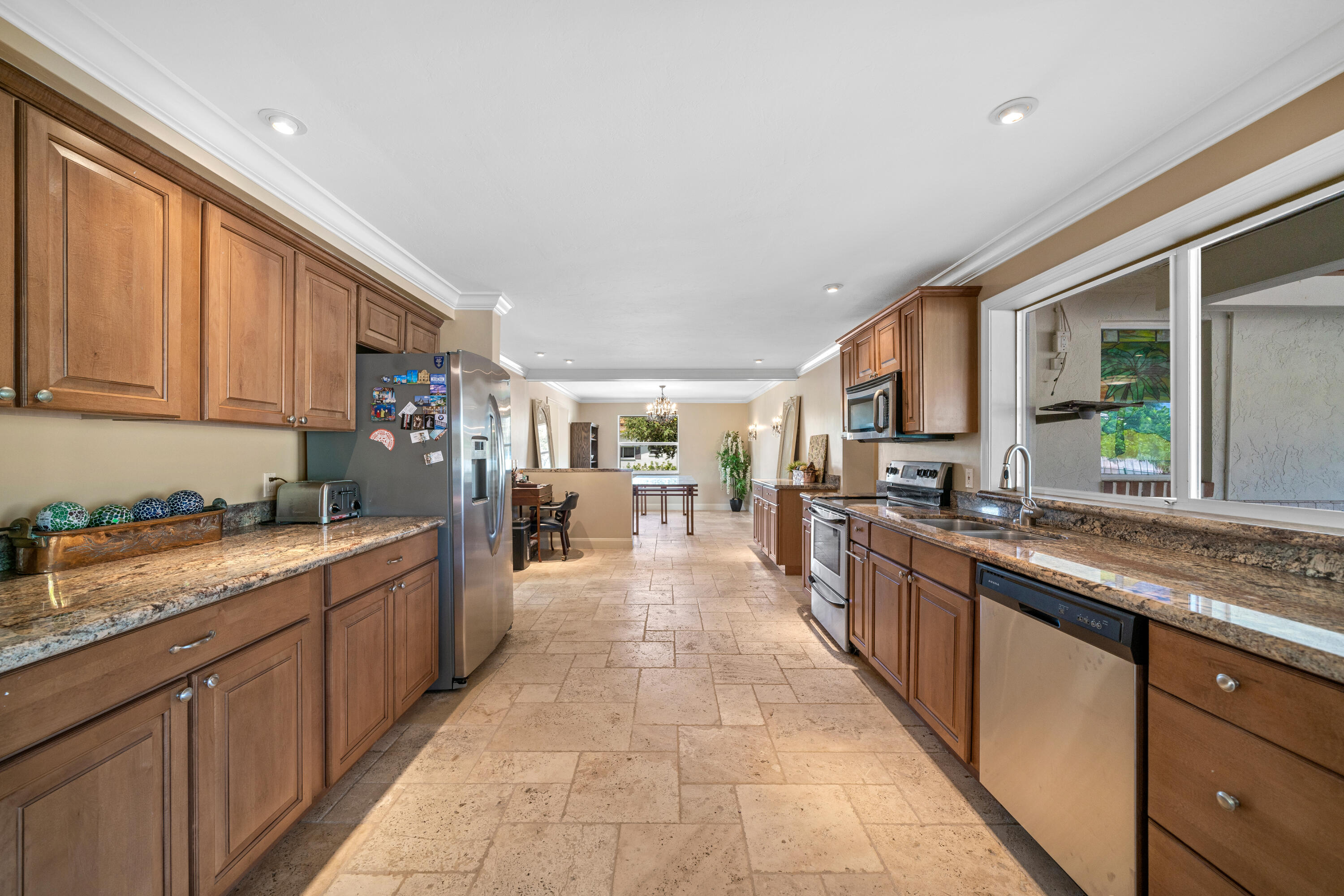 18 Duke Drive Lake Worth, FL 33460 - Photo 10 of 29 a large kitchen with stainless steel appliances lots of counter space and a sink