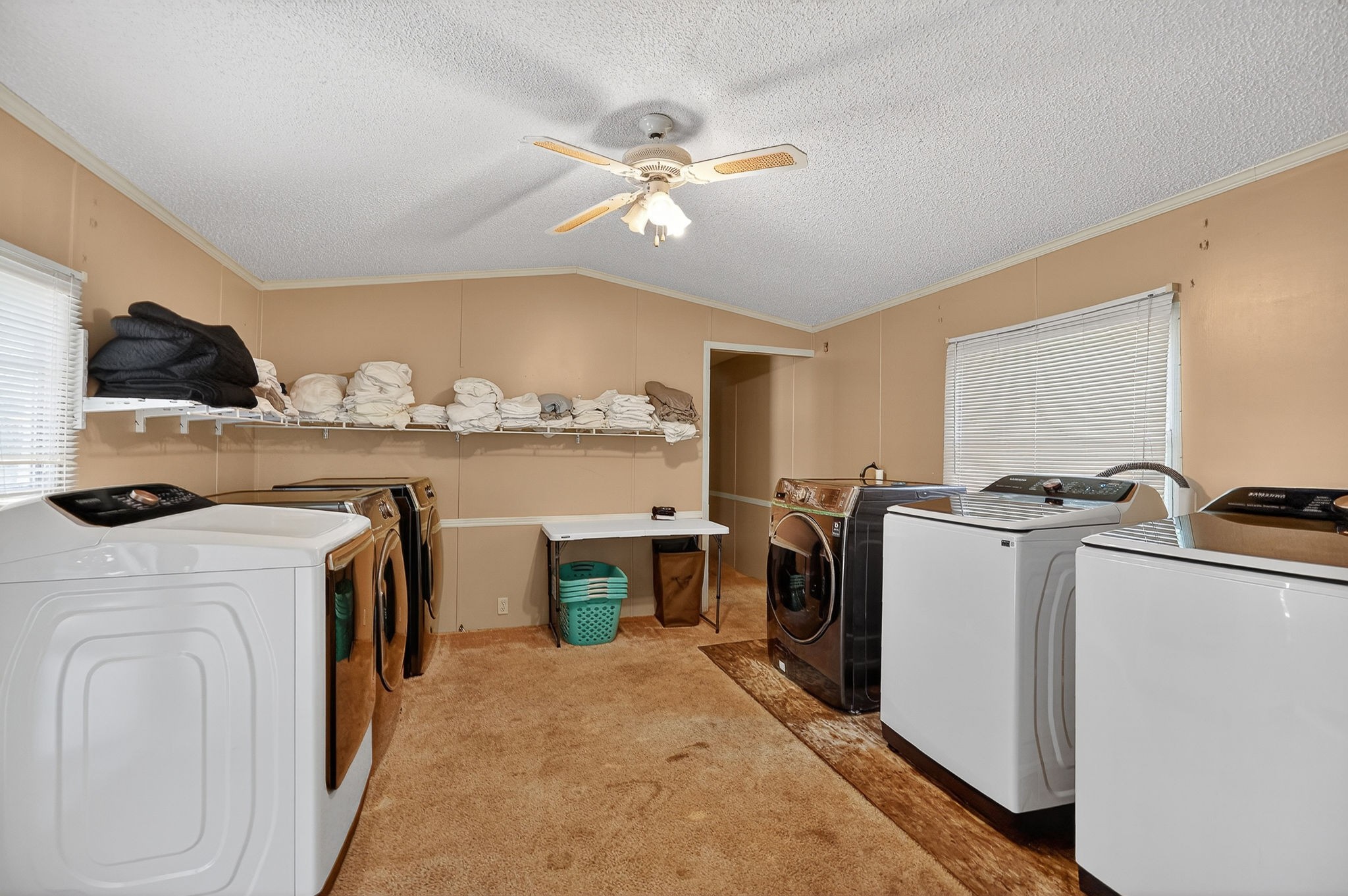 5682 Pates Ford Road Smithville, TN 37166 - Photo 8 of 12 a view of a storage & utility room with washer and dryer
