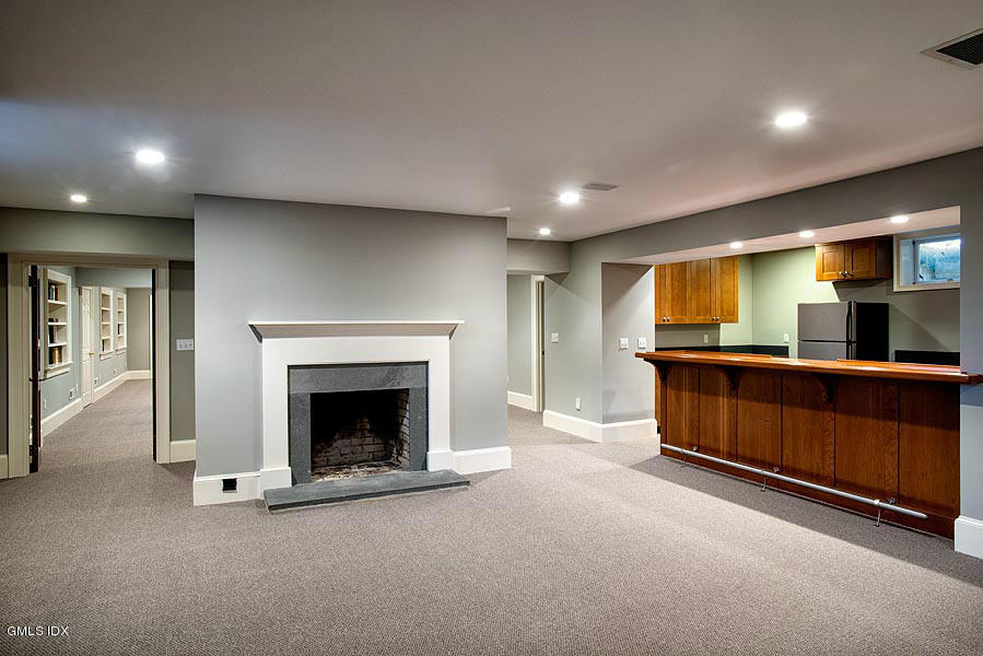 14 Golf Club Road Greenwich, CT 06830 - Photo 16 of 20 a living room with furniture and a fireplace