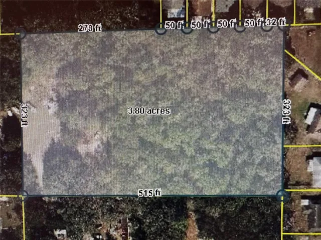 a view of a balcony with a small yard