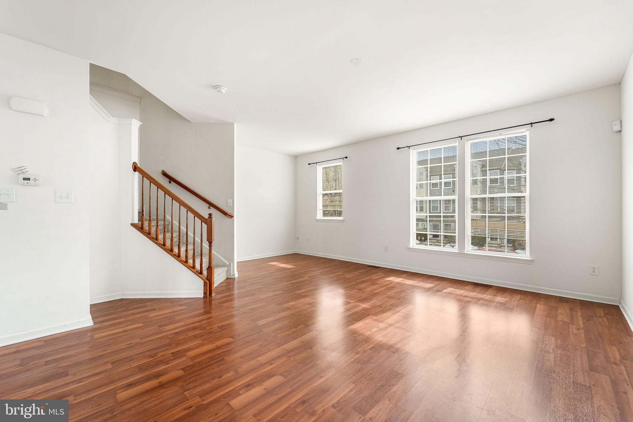 22 River Lane Delanco, NJ 08075 - Photo 20 of 43 a view of an empty room with wooden floor and a window