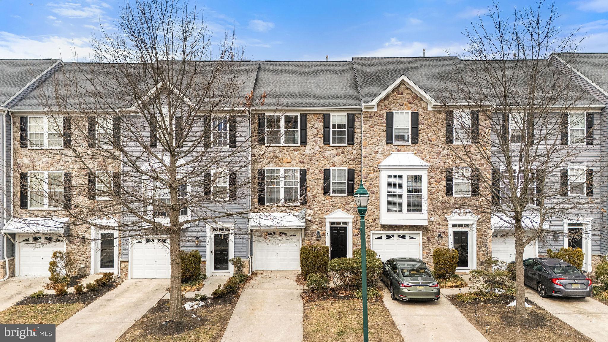 22 River Lane Delanco, NJ 08075 - Photo 2 of 43 a front view of residential houses with yard