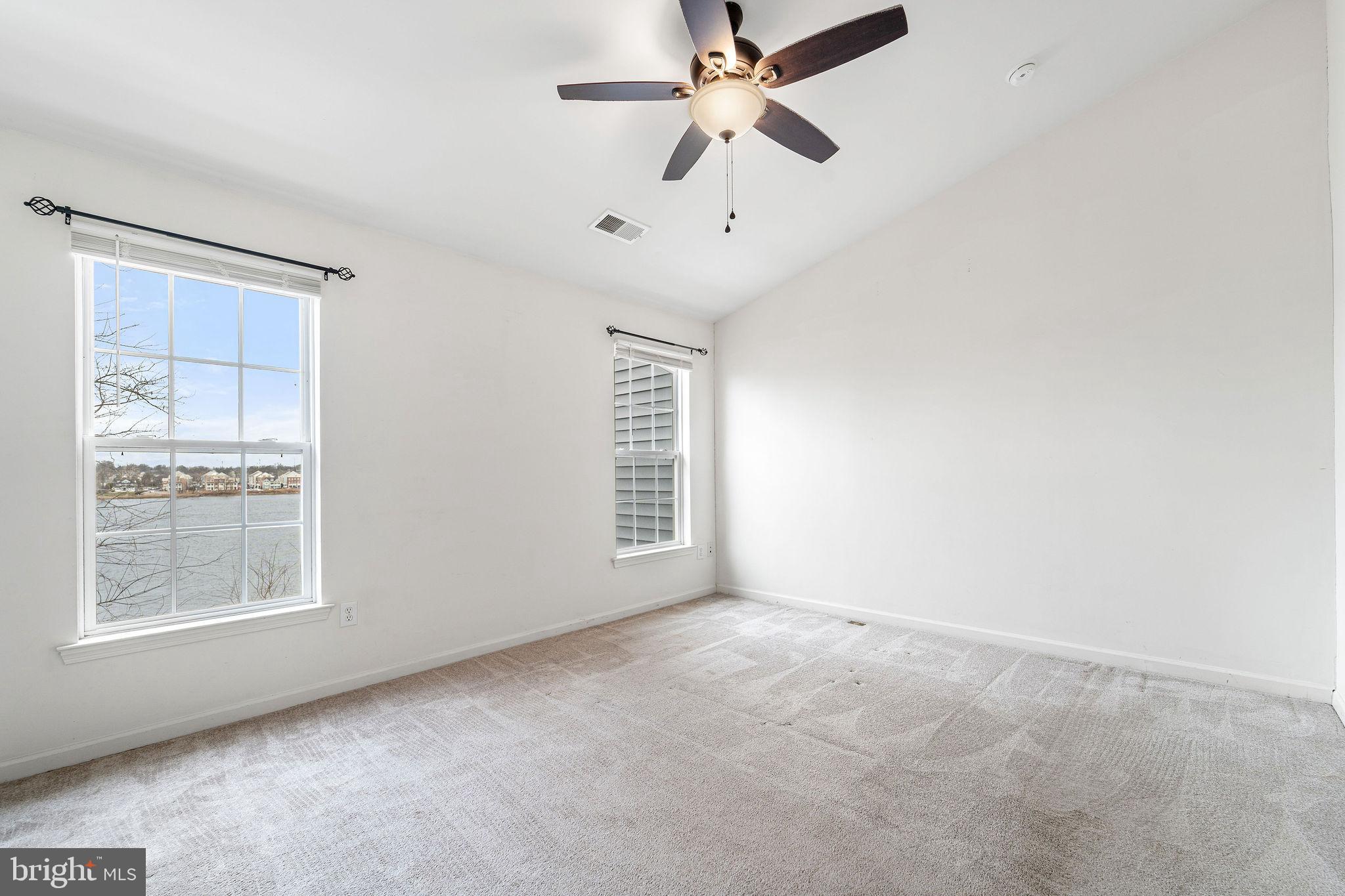 22 River Lane Delanco, NJ 08075 - Photo 26 of 43 an empty room with windows and fan