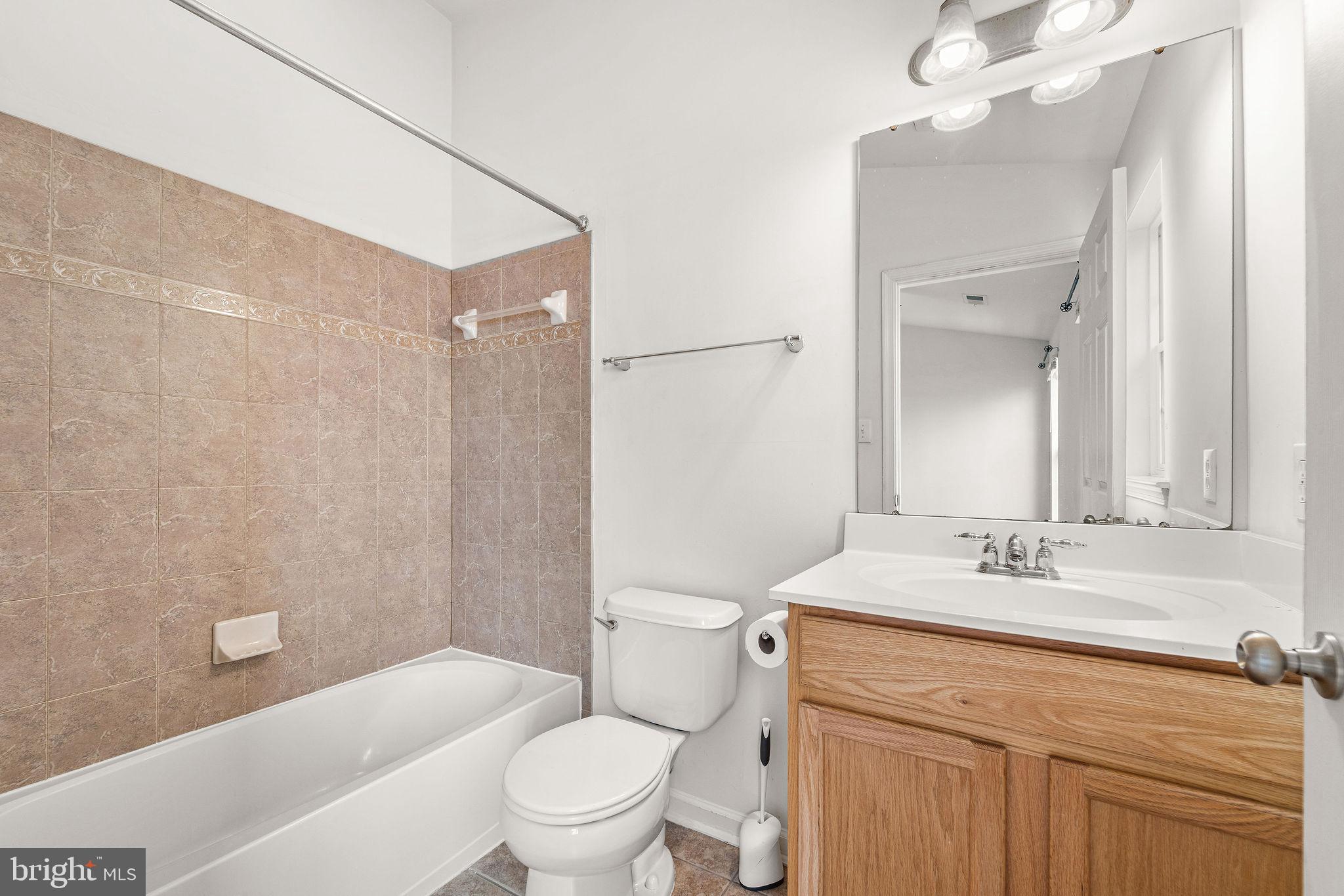 22 River Lane Delanco, NJ 08075 - Photo 29 of 43 a bathroom with a sink a toilet and shower