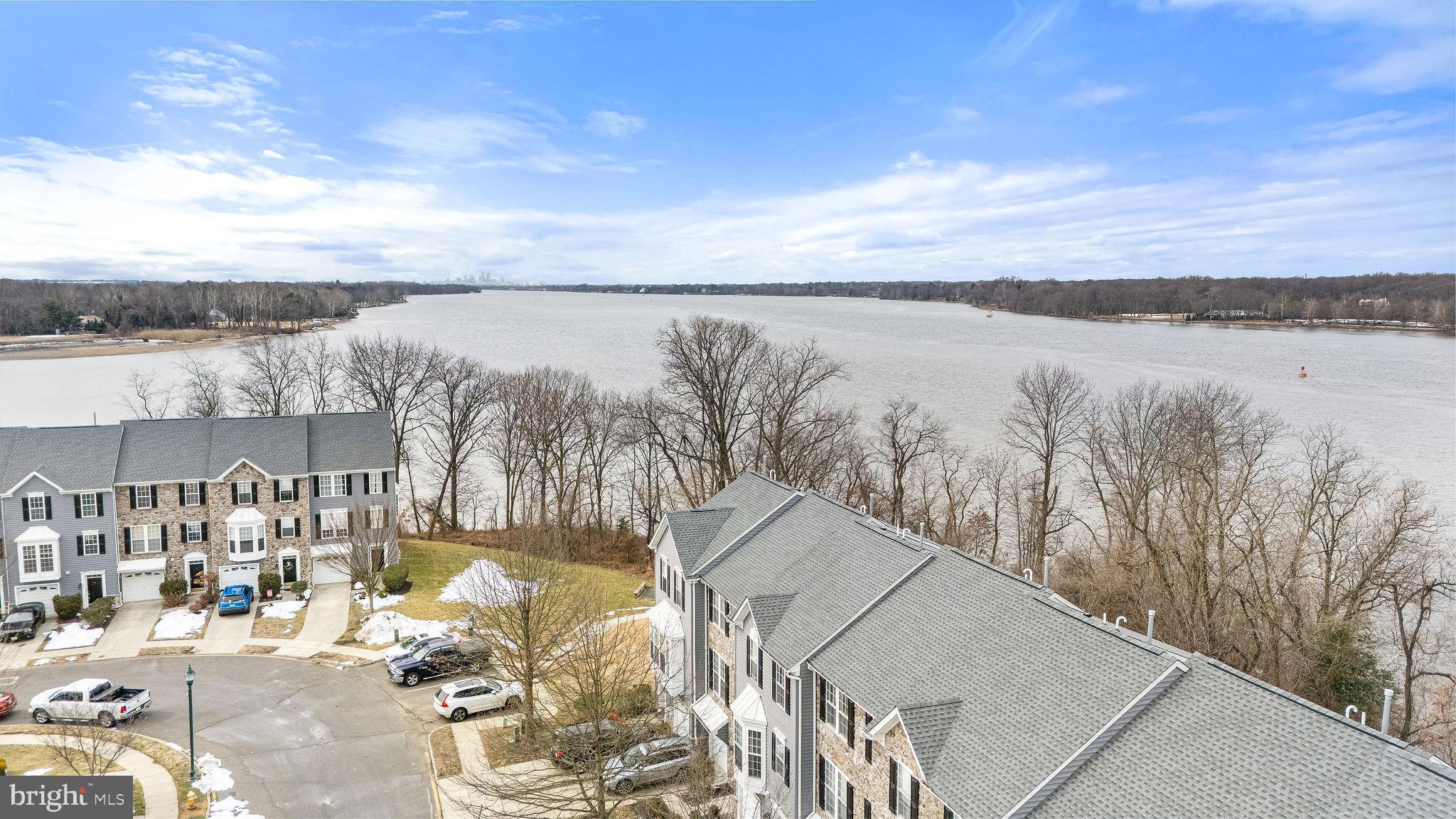 22 River Lane Delanco, NJ 08075 - Photo 36 of 43 a view of a lake with a city