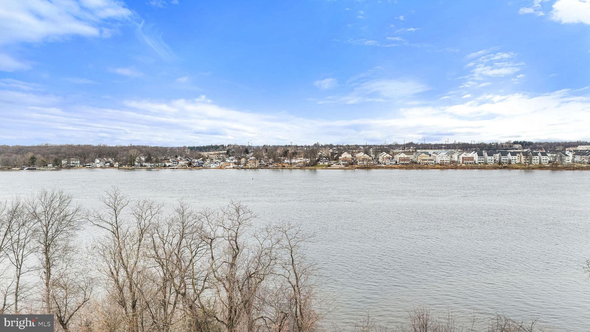 22 River Lane Delanco, NJ 08075 - Photo 5 of 43 a view of a lake with houses in the back
