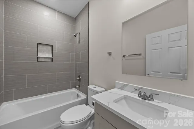 a bathroom with a sink toilet and bathtub