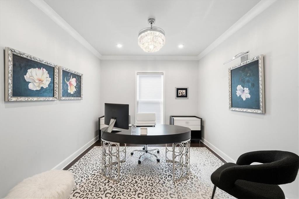 2457 Naples Street Hoschton, GA 30548 - Photo 26 of 41 a work room with furniture and a potted plant