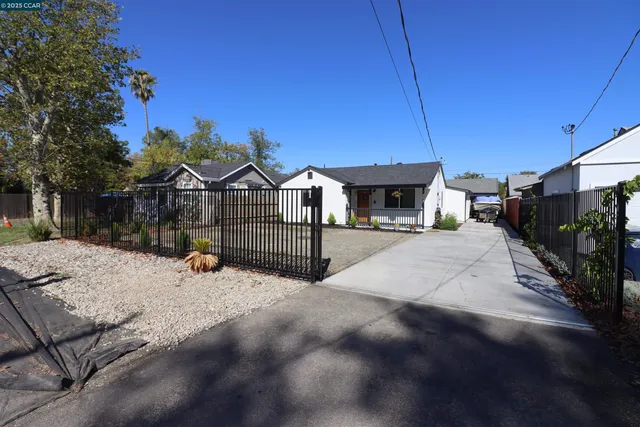 a view of house with backyard and entertaining space