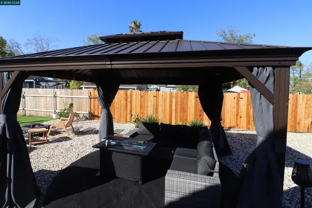 a front view of a house with sitting area