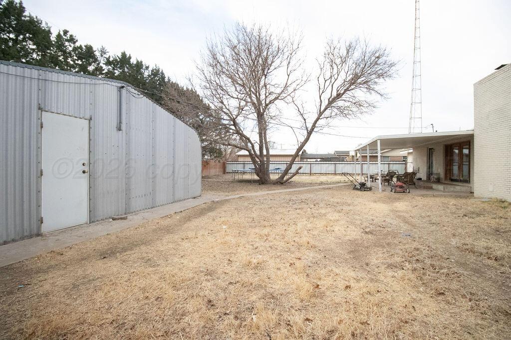 1205 Division Street Stratford, TX 79084 - Photo 13 of 14 a view of a covered with snow in the yard