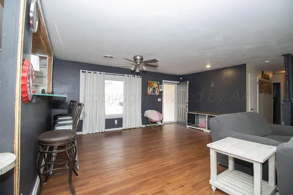 a view of kitchen with furniture and wooden floor